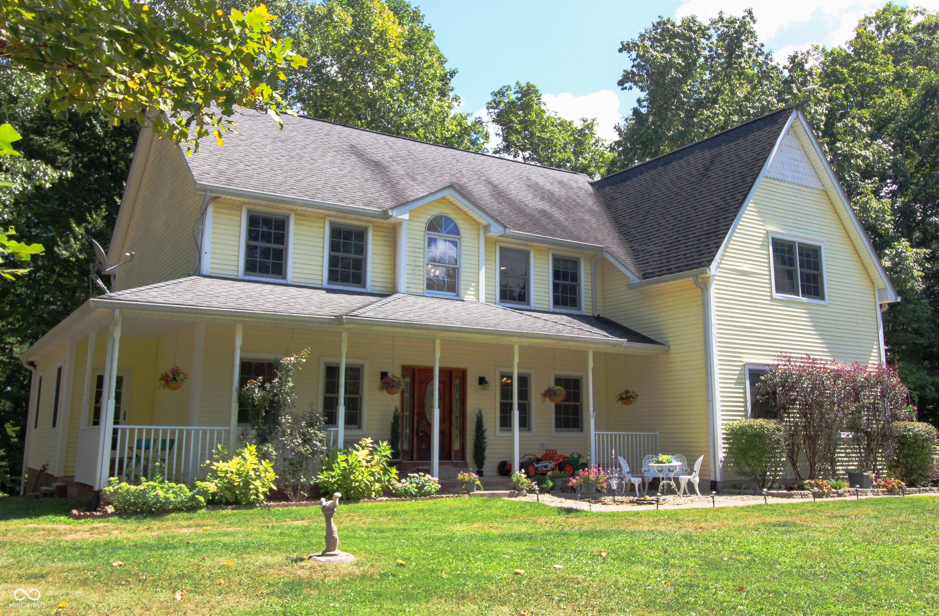 Discover this stunning custom-built 2-story home nestled on 11.66 beautifully wooded acres with a peaceful creek running through the property. Perfect for nature lovers, this serene retreat is teeming with wildlife including deer, birds, and other native animals. Recently remodeled from top to bottom, this 5-bedroom, 5 bathroom home offers modern luxury, timeless charm, and exceptional privacy. Upstairs, the expansive primary suite is a true oasis featuring a private sitting room, two large walk-in closets (plus an additional closet), a spa-inspired ensuite bath with a custom tile shower and seamless glass door, freestanding soaking tub, double vanity with pullman-height counters, and bidet. Step onto your private deck and enjoy breathtaking morning views of your wooded backyard. Four additional bedrooms and two fully remodeled baths complete the upper level.  The main floor showcases an open-concept layout with a dream kitchen that includes a massive 10' x 3.6' island with a butcher block top and vegetable sink, custom hood fan, farm sink, walk-in pantry, tile backsplash, stainless steel appliances, touchless faucets, and designer lighting. Beautiful hardwood floors and new luxury vinyl plank flooring extend throughout. Additional features include a finished side-load 3-car garage, three 50-gallon water heaters, (2) 200-amp service panels, and high-speed fiber internet. The 46x12 main deck is perfect for entertaining or relaxing. The walk-out basement features a large family room, remodeled half-bath with plumbing for a full bath, and two flexible rooms ideal for a home office, gym, or creative space. The entire basement has been freshly drywalled and painted. Energy-efficient geothermal system installed 10/27/2020.  Don't miss this one-of-a-kind property that combines modern living with natural beauty. Schedule your private showing today!