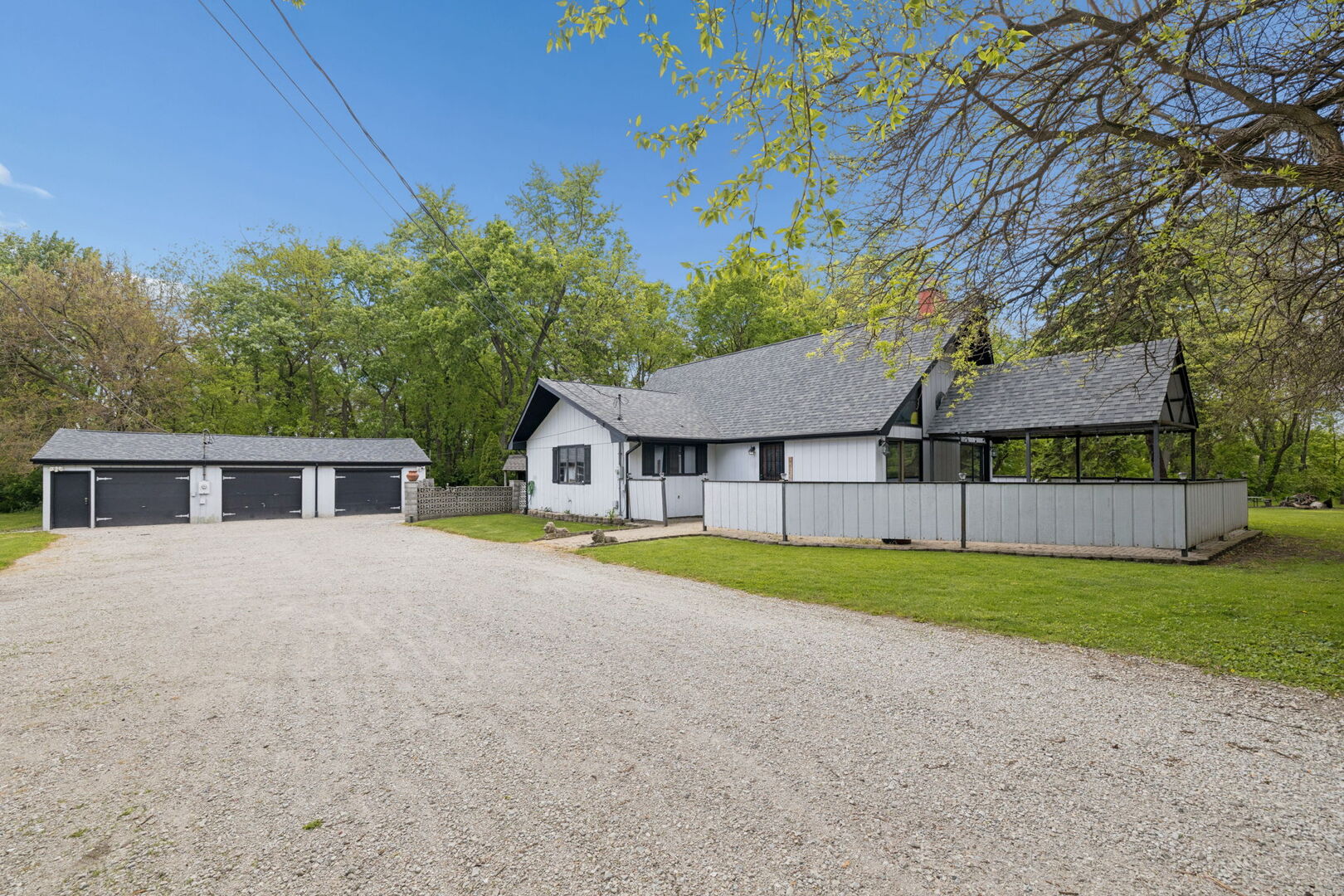 Incredible opportunity to own this one of a kind, A-frame home on over a half acre lot in unincorporated New Lenox! Full of character, privacy, and potential, this rare property offers 3 bedrooms, 3 full bathrooms, an oversized loft, a finished partial basement, and a 3-car detached garage.  Step inside and you're welcomed by soaring ceilings, exposed beams, and walls of windows that fill the home with natural light. The updated kitchen features granite countertops, stainless steel appliances, a large pantry closet, and flows perfectly into the separate dining area. All three bedrooms are conveniently located on the main level, including a primary suite with a private full bath, plus two additional bedrooms and another full bathroom on the opposite side of the home. The living room offers a cozy wood-burning fireplace and access to the fenced-in brick paver patio. Upstairs, the oversized loft provides the perfect flex space for a home office, playroom, guest area, or potential additional bedroom. The finished partial basement adds even more usable living space, complete with a full bathroom, large utility/laundry room, ample storage, an office, and a separate workshop room. Outside, the yard is a peaceful retreat surrounded by mature trees and backing to the Old Plank Trail. Enjoy over a half acre of privacy featuring an oversized back deck, storage shed, chicken coop, and a treehouse! Plus an impressive 3-car detached garage with one climate controlled bay and recently updated electrical. BBQ grill comes with the property and is hooked up to natural gas. Major mechanical updates have already been taken care of with a new furnace and AC, plus a roof that is only 6 years young. Located within the highly sought-after New Lenox/Lincoln-Way award-winning school district, this truly unique home offers space, character, and endless potential in a fantastic location. Opportunities like this do not come often!