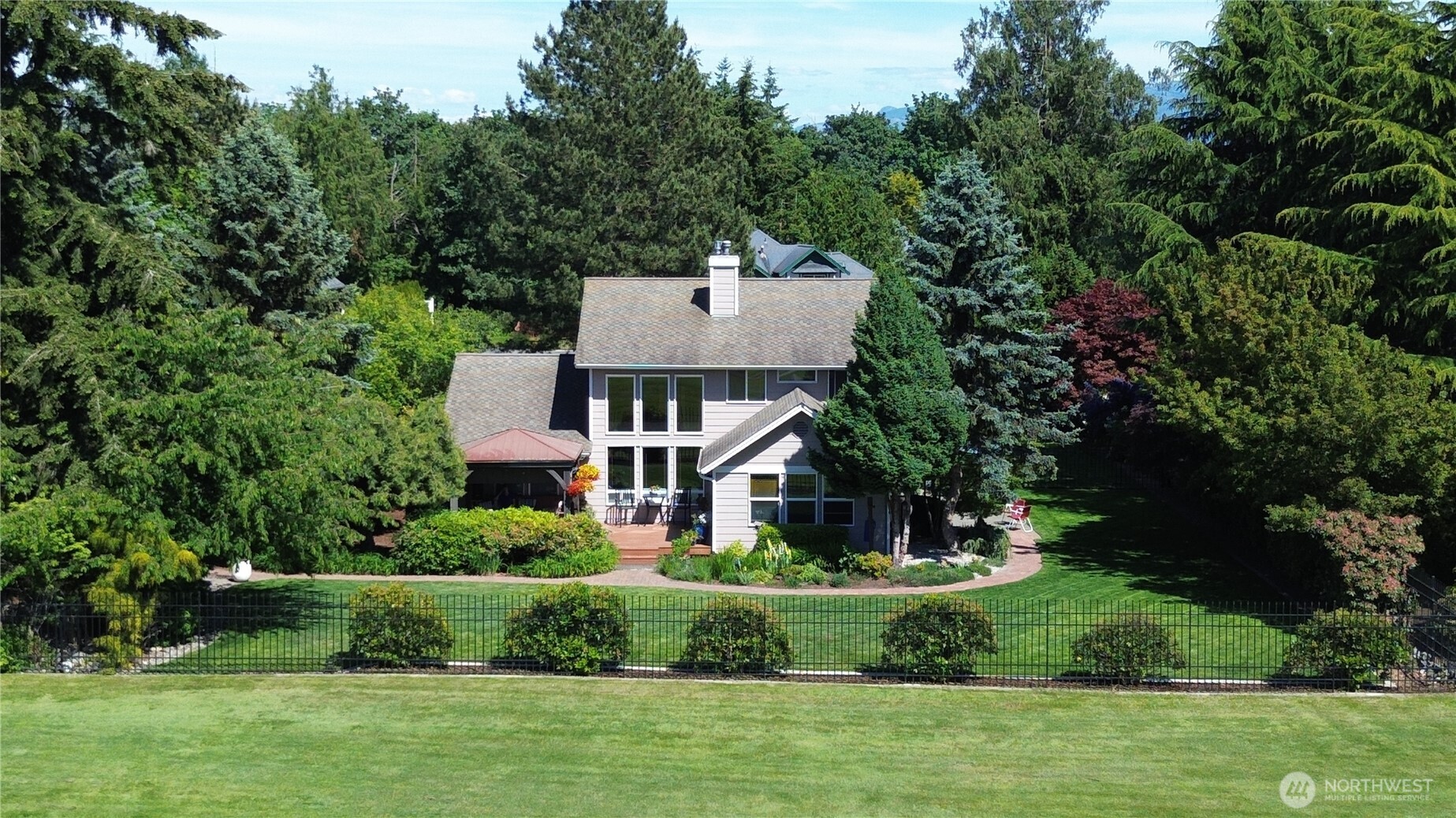 Beautiful golf course home sitting on a 1/2 acre lot and located on Skagit Golf and Country Club with views down the 8th fairway and across the 9th tee.  The main floor features a spacious kitchen, granite countertops, and a large island bar, perfect for gatherings, garden window.  The kitchen opens to family room with fireplace and slider out to the side yard patio. Enjoy formal or casual dining with a dining area that has a sliding door out to the deck and gazebo for easy indoor-outdoor enjoyment. The living room boasts 18-foot ceilings with views of the golf course and a gas fireplace, open to the loft. Main floor also includes a laundry room with 1/2 bath, two guest bedrooms and a full bathroom. Upstairs you will find a large loft, currently used as a home office along with a spacious primary bedroom with another fireplace and  3/4 bath which includes double vanity, heated tile floors and ample storage. Fully fenced back yard with mature landscaping, deck with gazebo, garden space, 12 x 16 cart shed with an automatic garage door, 8x10 garden shed. Fully finished, heated garage with tile floor and brand new garage doors.  Most windows are newer.  Crawlspace was just redone with new insulation and vapor barrier.  A very nicely maintained property!  Sunsets are amazing!!