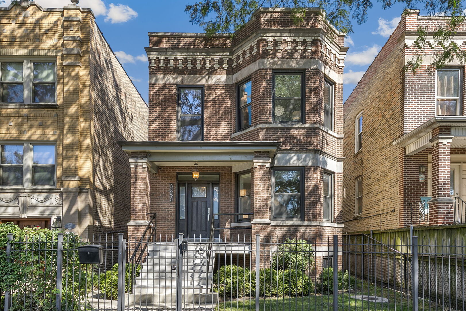 Welcome to 3855 N Christiana - this classic 1912 brick beauty was reimagined from two-flat into a stunning 3,400 sq. ft. single-family home situated on a 30' lot in the heart of Irving Park. It was thoughtfully converted to meet the needs of modern living while retaining its timeless curb appeal. Step inside and you'll find 5 bedrooms and 3.5 baths, designed with room for everyone and everything. The heart of the home is the open kitchen and adjoining family room, where a dramatic glass wall opens to a large deck-perfect for summer barbecues, birthday parties, or quiet evenings under the stars. A dedicated dining room and gracious front living room with fireplace set the stage for memorable gatherings, while three upstairs bedrooms offer peaceful retreats. The primary suite is a true surprise, featuring an ensuite bath and a full wall of closets. Thoughtful updates throughout include stainless steel appliances, marble and granite countertops, designer lighting, a Nest thermostat, and newly refinished hardwood floors. Downstairs, a finished lower level with a wet bar expands your options for entertaining or relaxing. Laundry hook-ups both upstairs and downstairs. Outside, the manicured backyard and two-car masonry garage add ease and beauty to everyday life. Located on a tree-lined block known for its annual block party and welcoming spirit, you'll feel at home the moment you arrive. Just steps from shopping, dining, everyday conveniences along Irving Park Road and near the Kennedy, this is a home that grows with you. Don't miss the chance to make it yours-schedule your tour today.