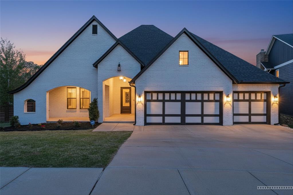 Modern tudor style home that has a fabulous greenbelt lot in the desirable Hidden Creek Addition.  A beautiful white exterior greets you with generous front porch.  Dedicated soaring entry leads you past the staircase into the expansive living, kitchen and dining areas. Perfect flow for entertaining.  Warm wood tile floors throughout.  Living area has cozy fireplace and features stunning backyard greenbelt views.  Kitchen has a gorgeous island, spacious dining area, lots of cabinets and a walk-in pantry. Office is off main living and it could be a 5th bedroom.  Two additional ensuite bedrooms can be found on the main level. Upstairs has an additional bedroom, full bath and very large bonus room.Enjoy a peaceful view from your large covered patio and backyard retreat.  Yard is a perfect size. Hidden Creek has a park, pavilion and basketball court.Prime Edmond location offers easy access to I-35, restaurants, shopping, movies, medical and all that Edmond has to offer. You will feel proud to call this one HOME! Don't miss out—schedule your private tour today! Welcome home!  All appliances and furniture for sale and negotiable.