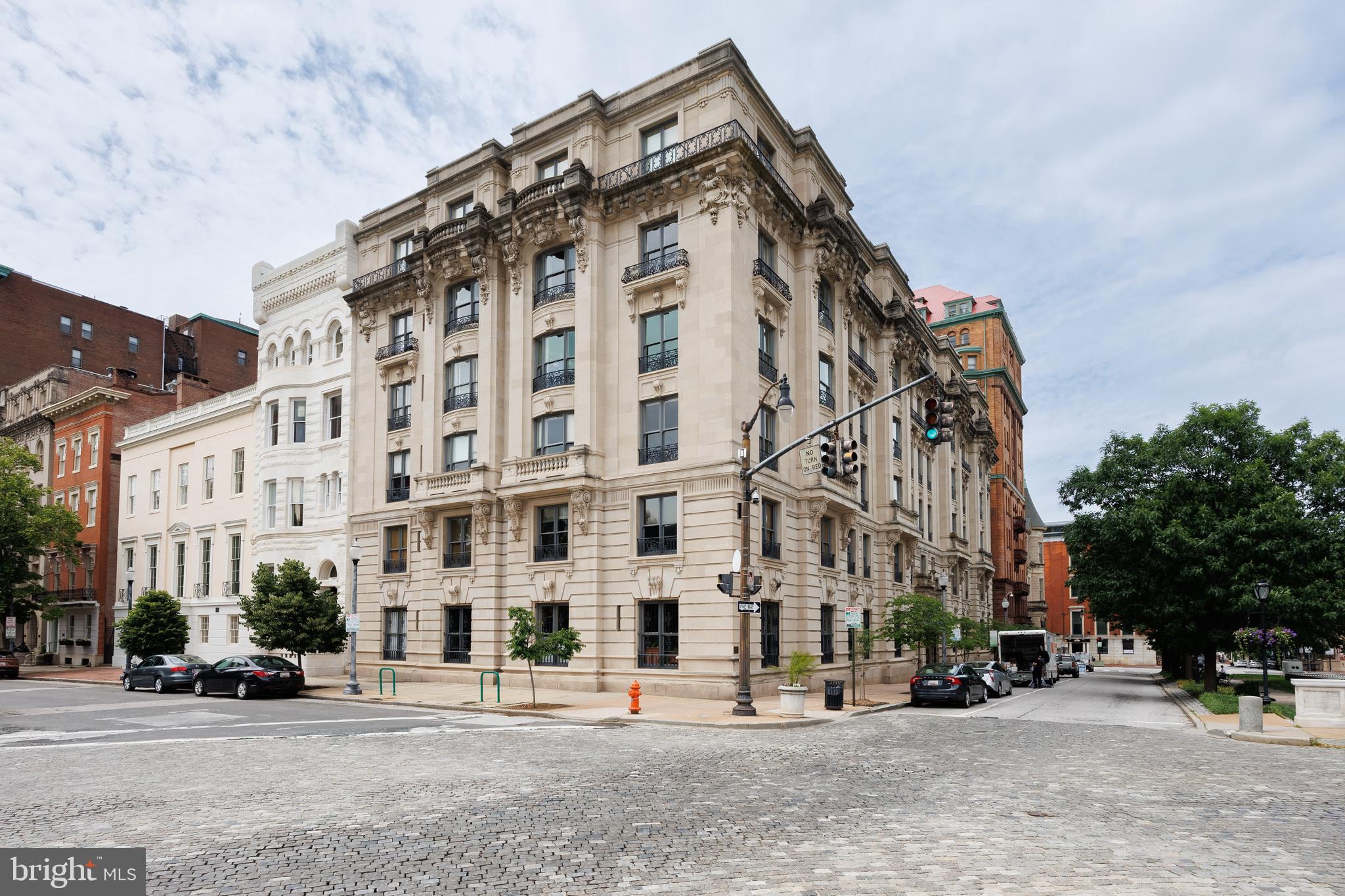 Elegant Historic Living at 700 Washington Place – Mt. Vernon’s Crown JewelWelcome to 700 Washington Place, Apartment 4B, located in one of the most prestigious and architecturally significant buildings in Baltimore’s historic Mount Vernon neighborhood. This rare 3-bedroom, 2-bath residence offers an exceptional opportunity to own a piece of history with over 2,000 square feet of living space, stunning architectural details, and sweeping views of some of the city’s most iconic landmarks.Step inside this beautifully preserved Beaux-Arts masterpiece, where timeless elegance meets modern convenience. Apartment 4B retains its original finishes and historic charm, including a marble fireplace mantle, deep crown molding, and oak floors with mahogany inlay. The layout includes a formal living room, music room, dining room, and a kitchen with butler’s pantry—complete with in-unit laundry and updated appliances.The primary suite features generous closet space, large French doors, and a modern ensuite bath. Two additional bedrooms offer floor-to-ceiling closets and share a second full bath, ideal for guests or family living.Enjoy views of Mt. Vernon’s treasured landmarks—including the Washington Monument, Peabody Institute, Garrett-Jacobs Mansion, and Mount Vernon Place United Methodist Church—from your windows.This cat-friendly building offers unmatched amenities:Monthly fee includes property taxes, heat, 24-hour security, doorman service, six-day-a-week trash and delivery pickup (directly from your kitchen closet), water & sewer, building maintenance, and insuranceOwners are only responsible for electricity and internetPerfectly situated just steps from Penn Station, Johns Hopkins University, the Peabody Institute, and the vibrant dining and arts scene along Charles Street, this home places you in the heart of culture, history, and convenience.Own a piece of Baltimore’s rich architectural legacy—schedule your private tour of 700 Washington Place, Apartment 4B today.