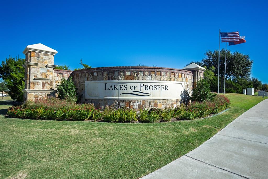 From the moment you step through the front door, the grand foyer makes a lasting impression with its soaring 13-foot ceiling and graceful sense of scale. To your right, elegant French doors open to a private office or guest suite—an ideal space for quiet work or relaxation—conveniently near a well-appointed powder bath. Subtle architectural details, including framed wall insets along the hallway, offer the perfect showcase for fine art or personal collections as you move toward the heart of the home.

The great room is stunning, bright, and designed for effortless living. A gas-log fireplace with a subtle mantle serves as the centerpiece, while large windows fill the space with natural light and frame views of the backyard. The open-concept design flows seamlessly into an inviting kitchen that blends beauty and function. A substantial granite island anchors the space with a built-in sink, dual outlets, and breakfast bar seating. The kitchen features stainless steel appliances, including refrigerator, dishwasher, built-in microwave, and electric oven with natural gas cooktop beneath a custom vent hood accented by downlighting.

A charming breakfast nook overlooks the backyard, while the formal dining room—with its statement chandelier and striking waffle ceiling—sets the stage for elegant entertaining. The primary suite is a serene retreat with recessed ceiling and ceiling fan. Its spa-inspired bath offers a deep soaking tub, walk-in shower with bench seating, dual vanities, and private water closet. The expansive walk-in closet includes a dedicated shoe rack for organization.

A secondary bedroom on the main level enjoys its own private bath, perfect for guests or extended family. Upstairs, the home continues to impress with a spacious bonus room ideal for recreation or lounging, plus a true media room with theater seating. Two additional bedrooms share a beautifully appointed full bath with a tub-and-shower combination, offering comfort and privacy for all.