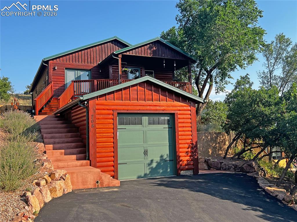 This quiet mountain retreat in the sought-after Crystal Hills neighborhood offers stunning views of Pikes Peak, Garden of the Gods, and the surrounding hills, all from a peaceful, dead-end street that provides both privacy and a strong sense of community. Immaculately maintained home with an open-concept, main level showcases vaulted ceilings, abundant natural light, a gas fireplace, and high-quality finishes including Douglas fir wood floors and a newly remodeled kitchen with premium appliances and custom details. The main level office would make a perfect family room. More office potential downstairs. The primary suite includes a walk-in closet and ensuite bath. The laundry facilities are on the main level with an additional hookup downstairs. Secluded rear yard. Amenities include: metal roof, vinyl windows, high-efficiency Trane furnace, central A/C, fresh carpet, front and rear decks, engineered retaining wall, 2 x 6 construction, recently stained log siding, 280 square foot storage area, gardening shed and a hot tub. Easy walk to Manitou's trail system and the Crystal Park Cantina (Mexican restaurant)!