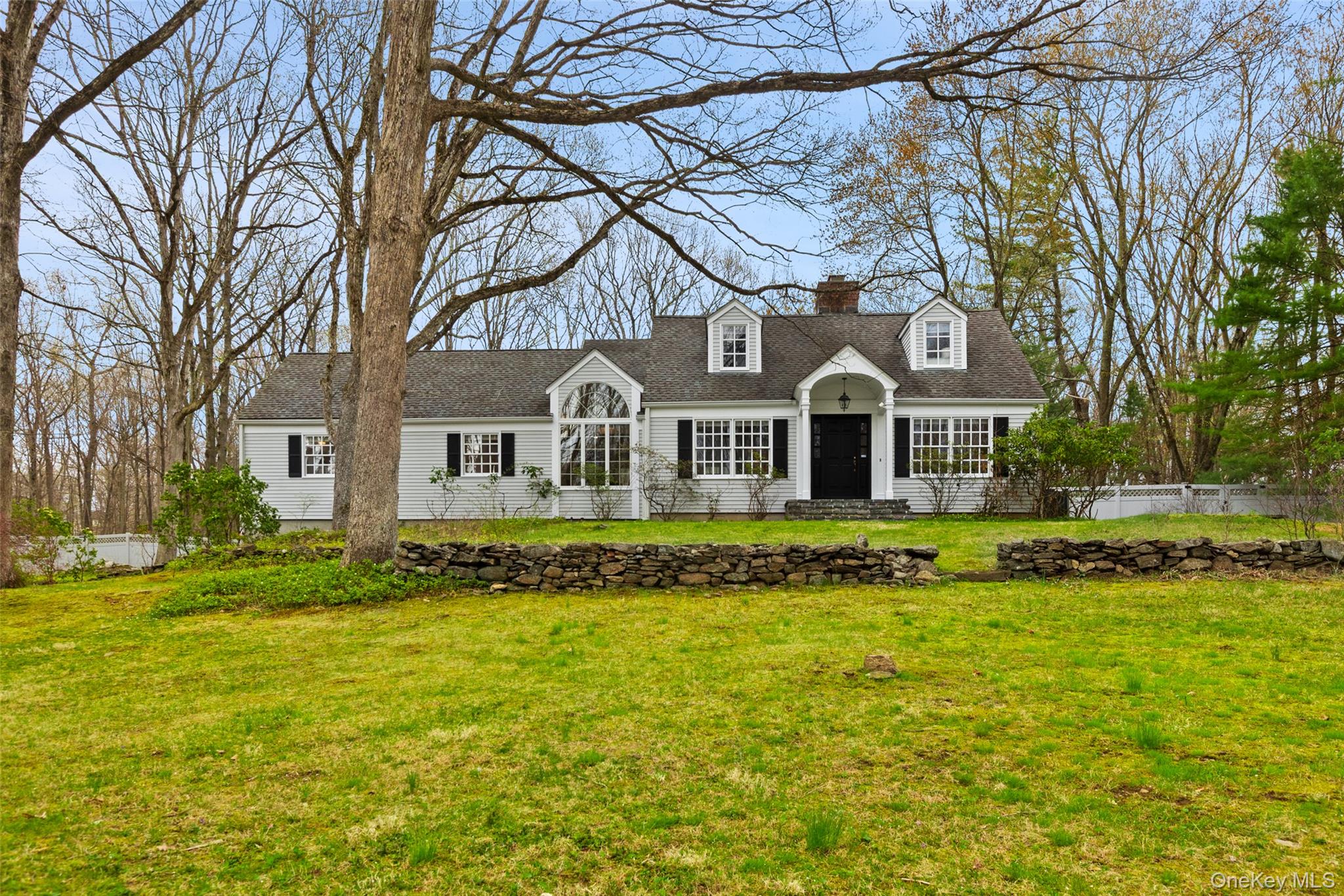 Looking for an easy living home in Pound Ridge, New York with land, privacy, and a pool, plus a touch of celebrity history?This Cape/Colonial residence—visited by super model, Stephanie Seymour—offers pristine interiors, a first-floor primary suite, and resort-style outdoor living on beautifully usable land.A glorious setting with rock outcroppings, a flat usable yard, pond with resident wild ducks, and a free-form heated Shoreline gunite pool, this property blends nature, privacy, and livability on one of Pound Ridge’s most desirable roads.Inside, the home is designed for effortless daily living and entertaining. A Shaker-style kitchen in "au courant" soft beige and light blue accents anchors the main level, complemented by oversized windows that flood the space with natural light and create seamless indoor-outdoor flow. The layout supports both quiet routines and larger gatherings without compromise including a whole house generator. The first floor primary suite features vaulted ceilings, a walk-in closet, two additional closets offering ample space and functionality. Upstairs, three flexible rooms can serve as bedrooms, office space, and flex space or a combination depending on your needs.Throughout the property, thoughtful stonework ties the aesthetic together from the front entry path to the back patio and pool surround creating a cohesive, timeless feel. Carefully chosen mature Azaleas, Lilacs, Rhododendrons, Mountain Laurels along with the kitchen garden beds add to the lifestyle appeal for those who value connection to the land.If you’ve been waiting for a property that balances privacy, easy living, and functionality in Pound Ridge, this is it.