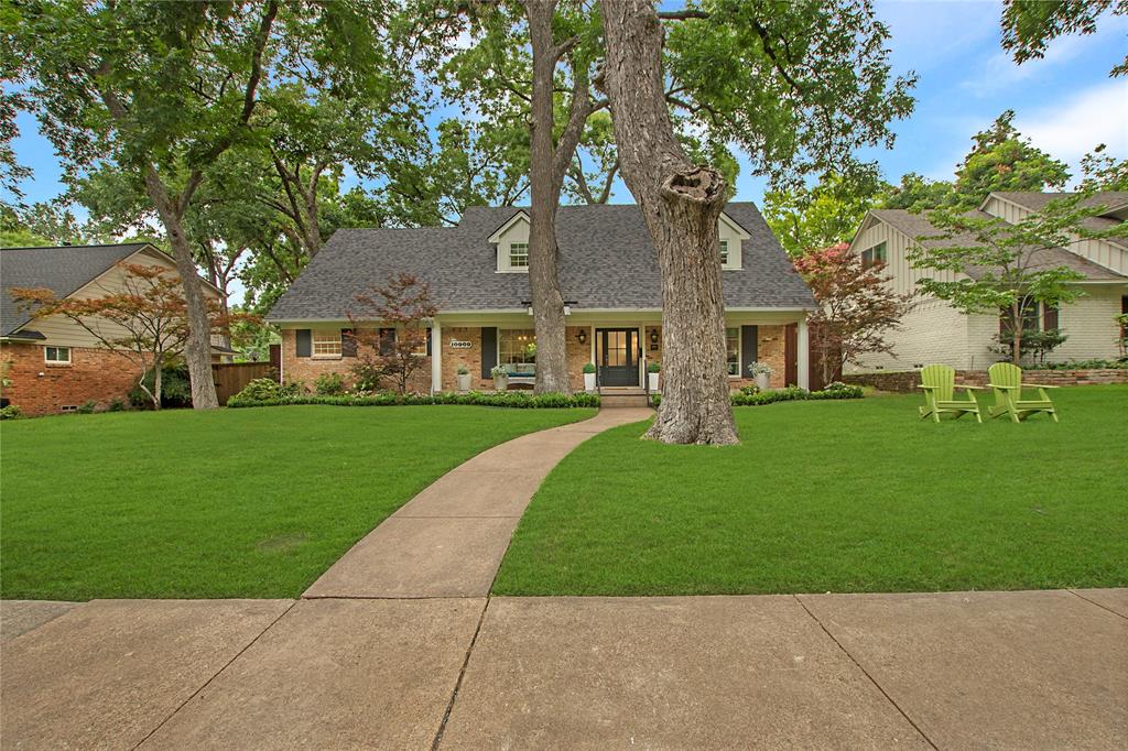 Renovated in 2024, this five-bedroom home in the heart of Lochwood offers nearly 3,000 square feet of timeless living space in one of East Dallas’ most established neighborhoods. The kitchen features Café appliances, brass hardware, a walk-in pantry, and a breakfast nook filled with natural light. The first-floor primary suite includes a spacious bathroom and oversized walk-in closet, while the second floor offers four additional bedrooms and a versatile den. Outside, the backyard is designed for both privacy and entertaining, with a covered patio, built-in outdoor kitchen, firepit, turf lawn, and a custom deck built around mature trees. Located minutes from White Rock Lake and within walking distance to Lochwood Park.