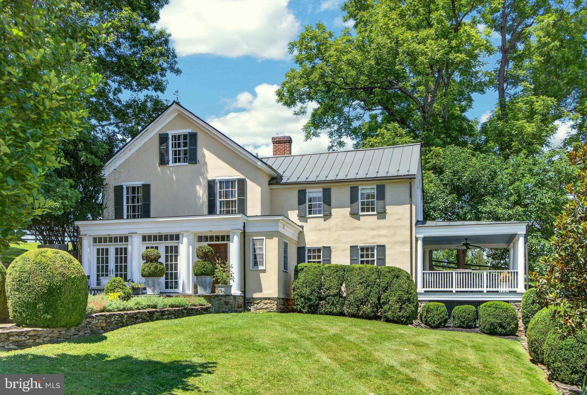 Welcome to Boxwood Glen, a conveniently located, c1870 home with all the charm of an antique home and the tasteful modernization for today's lifestyle.  Enter down a long, tree lined, private drive to the pea gravel motor court and stone walkway to the residence.  The house exudes charm and is enveloped by mature gardens on all sides. The spacious living room includes a large fireplace and opens onto a covered porch. The kitchen and mudroom were recently renovated to include marble counter tops, stone sink and high end stainless appliances. There are 4 bedrooms situated on three floors. The primary bathroom was just renovated in 2026. The HVAC, septic system and back up generator are all new as of 2026 as well. For the horse enthusiast, a separate drive leads to the well constructed 12 stall barn with separate tack room and wash stall. There are 6 paddocks, all with a dedicated water supply. Boxwood Glen is move in ready and well suited as a peaceful weekend retreat or full time country home.