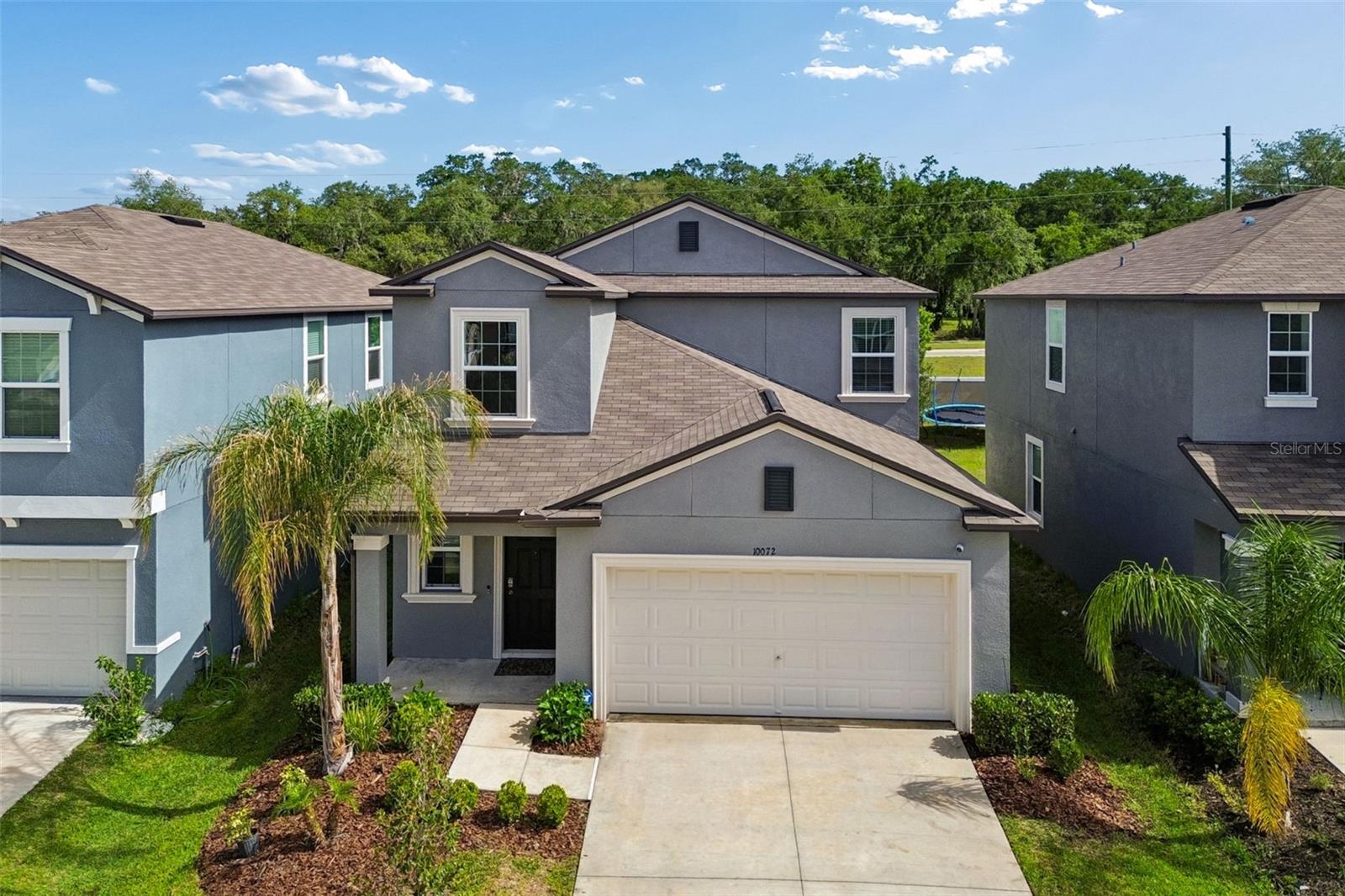 One or more photo(s) has been virtually staged. Welcome to this spacious TURN-KEY property featuring 5-bedroom, 2.5-bath , 2 car garage home offering over 2,300 square feet of comfortable living space in the heart of Wesley Chapel! The Columbia model shows like a brand-new home and is truly MOVE IN READY! The OWNERS SUITE  is conveniently located on the FIRST floor, providing privacy and ease of access. The first floor boasts a bright open-concept floor plan, with the kitchen that overlooks the main living and dining areas, creating the ideal gathering space for family and friends. The kitchen is both stylish and functional, showcasing granite countertops, ample cabinetry, a large pantry, and all kitchen appliances are included for added convenience.  Step outside to the spacious pavered SCREENED IN LANAI, the perfect place to relax, entertain, and enjoy the Florida lifestyle year-round! Upstairs, you’ll find a large loft area that offers endless possibilities for a media room, or a home office and offers additional living space and 4 additional bedrooms. All bedrooms are equipped with ceiling fans for added comfort throughout the home. The home is also fully fence and is equipped with outdoor lighting in the backyard area.Located in a golf cart-friendly community, Epperson residents also enjoy access to the stunning Crystal Lagoon, offering resort-style living, walking trails, playgrounds and dog parks. Enjoy the covinience of shopping, dining, entertainment, and top-rated schools! With close access to the highways, medical facilities, approximately 40 mins away from downtown Tampa, 1.5 hours or less from the Orlando theme parks and beaches, this home provides excellent value and space with an unbeatable lifestyle. Schedule your private tour today.