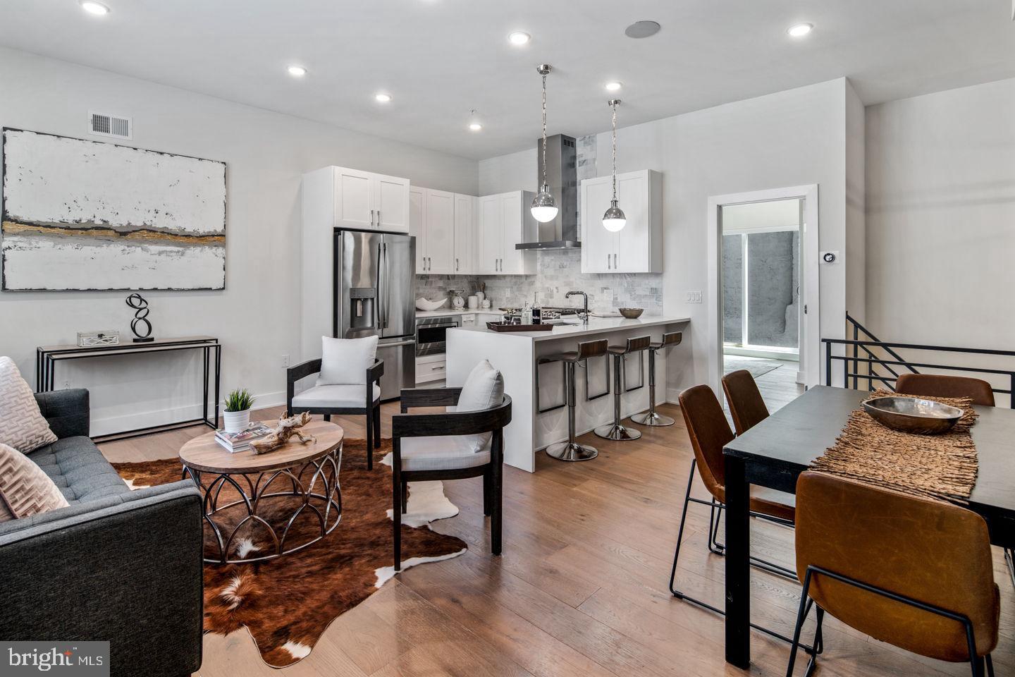 Get ready to be wowed by this stunning 3-bedroom, 3-bathroom condo and part of a luxury condo community. Ultra-luxurious, high-end new construction, with a backyard outdoor space. The first-floor features an incredibly modern yet elegant kitchen with seamless, soft-closing white shaker style cabinets and waterfall quartz countertops extend to a convenient breakfast bar, illuminated by large pendant lights. The 10 + ceilings create a dramatic effect to the living space. The modern chefs kitchen comes with stainless steel GE appliances with a gas range, Kohler Purist fixtures and white shaker style cabinets, offset by a luxurious Carrara marble backsplash. Your secluded private patio is accessed through PELLA sliding glass doors. Off the kitchen is a large bedroom, custom walk-in closet, and a monochrome ensuite bathroom with white cabinetry, quartz counters, hexagon tile floors, and matte black mullion shower doors. The lower level features another spacious bedroom with an ensuite bathroom and walk-in closet. A third bedroom with built in closet space and with full hall bathroom, laundry closet, and an open bonus space complete the level. This apartment has plenty of modern conveniences including a SONOS Sound system, NEST thermostat, and an AIphone Intercom security system with exterior cameras. Every floor is lined with gypcrete concrete and AcoustiCORK flooring to prevent sound penetration between each floor, a construction feature not commonly practiced in many buildings. Around the corner from the Francisville playground - perfect for pet owners. This prime Fairmount/Francisville location is steps away from Fairmount and has a Walk Score of 92. Nearby dining includes Telas, Bar Hygge, Rybread café, and Engimono Sushi. Nearby shopping includes Whole Foods, Target, and Fine Wines & Good Spirits. Approx 5 years remaining on the tax abatement. 100% abated on the property assessment and annual real estate taxes below $1,000!