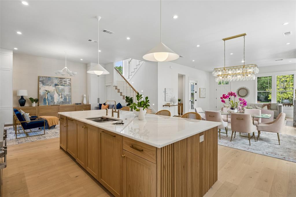 Welcome to 5438 Bonita. Crafted with intention and designed for modern Dallas living, this NEW-Construction Craftsman-style home blends timeless architectural character with refined, contemporary finishes. From its inviting curb appeal to its thoughtfully curated interiors, every detail reflects quality, comfort, and livability in one of the city’s most desirable, walkable neighborhoods, Vickery Place. The light-filled interior features hardwood floors, custom cabinetry, designer quality finishes and a layout ideal for everyday living and entertaining. The kitchen anchors the home with a striking oversized island, premium appliances, large wine fridge, pot filler, under cabinet lighting, prep kitchen and large walk-in pantry with abundant storage. You'll find a large gameroom with built in cabinetry and a fitness studio space on the upper level. The spacious primary suite is a true retreat, complete with a spa-like bath featuring a freestanding soaking tub, expansive walk-in shower and spacious closet with built-in shelving, drawers and a vanity area. Outdoors, enjoy a beautifully designed backyard with full landscaping, turf and a private putting green, creating a low-maintenance oasis perfect for entertaining, play, or relaxation. A covered outdoor living area with fireplace and grill extends the home’s livability year-round. An electronic gated driveway leads to epoxied garage and provides generous parking space. This home offers unbeatable proximity to walkable restaurants, coffee shops, boutiques, parks, and major thoroughfares—making it easy to enjoy the best of city living while coming home to a quiet, residential setting.