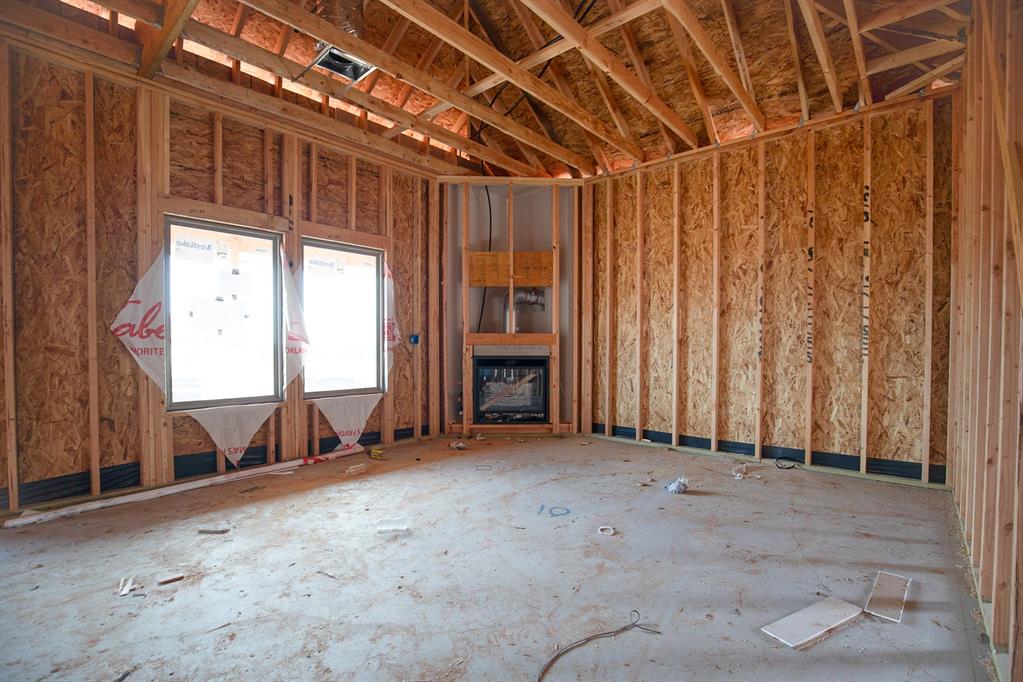 This Brinklee floor plan embraces 1,595 sqft of total living space, which includes 1,500 sqft of indoor living and 95 sqft of outdoor living space. This Taber home offers 3 bedrooms, 2 full bathrooms, 2 covered patios, a utility room, and a 2-car garage with a storm shelter installed. The living room provides a stacked stone surround corner gas fireplace, large windows, a ceiling fan, and wood-look tile. The high-end kitchen supports a large corner pantry, 3 CM countertops, custom-built cabinets to the ceiling, elegant tile backsplash, a center island, and stunning pendant lighting. The primary suite provides a sloped ceiling detail with a ceiling fan, windows, and our cozy carpet finish. The attached spa-like bath supports a free-standing tub, a spacious walk-in shower, a dual sink vanity, and a huge walk-in closet. The covered outdoor living section offers a wood-burning fireplace, a gas line, and a TV hookup. Other amenities include our healthy home technology, a tankless water heater, R-44 Insulation, a fresh air ventilation system, and so much more!