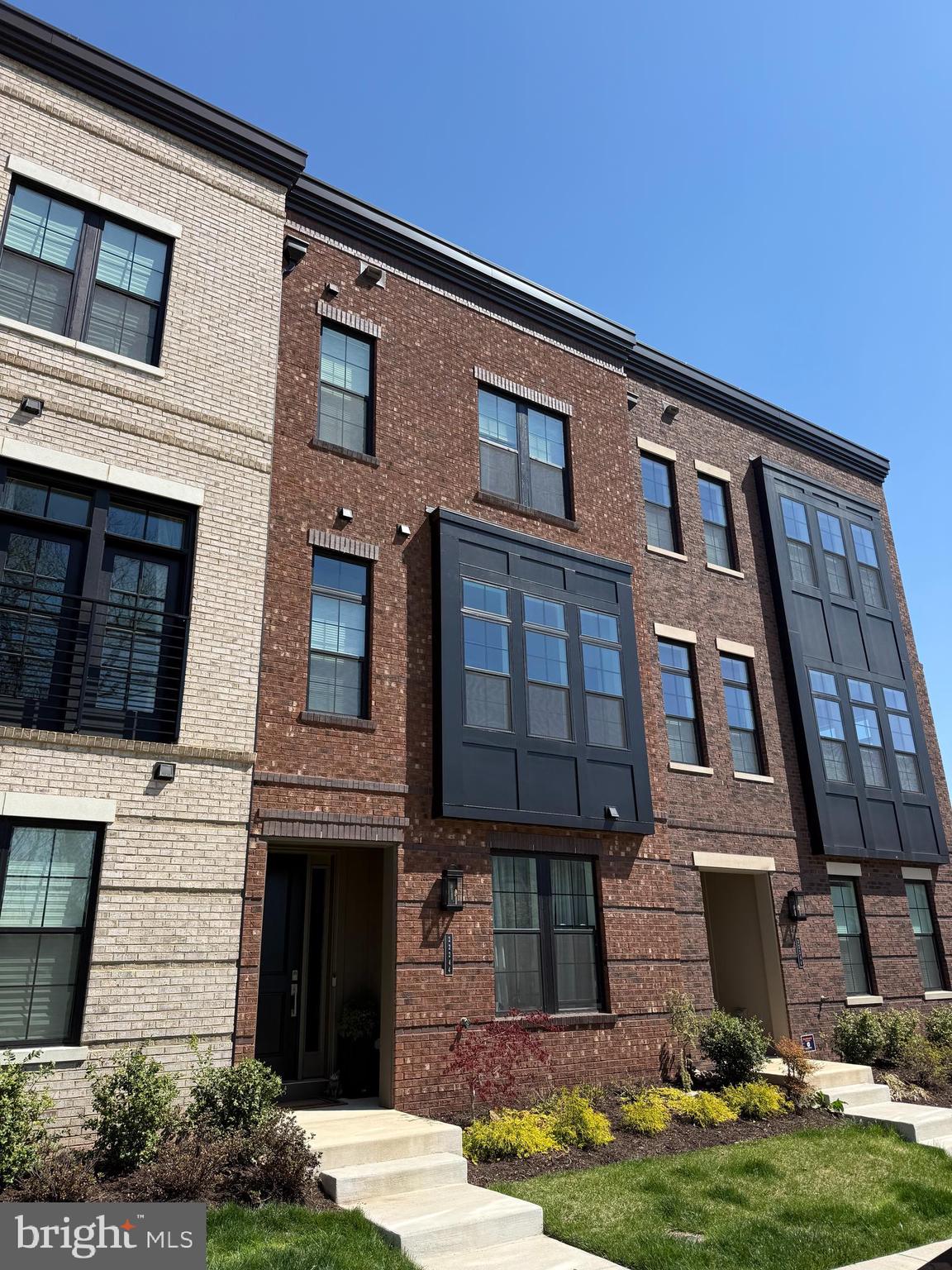 Welcome to 22244 Philanthropic Drive in the heart of Ashburn—an exceptional, upgraded residence that perfectly blends luxury, function, and modern design. You will NOT find these upgrades in another home in this centrally located MetroWalk Townhouse! Perfectly positioned, the front of the home faces a serene conservancy forest that cannot be built on, offering rare privacy, protected views, and a peaceful natural setting that will remain preserved for years to come!This stunning home boasts over $70,000 in high-end upgrades, thoughtfully curated to elevate everyday living. The centerpiece of the home is a fully customized wine wall, creating a dramatic and sophisticated focal point ideal for entertaining. The gourmet kitchen features a striking waterfall island, a fully renovated pantry with butcher block countertops, and premium finishes throughout.Designed with comfort and wellness in mind, the home includes advanced water treatment systems and dual UV light sterilization systems integrated into the HVAC units. Smart and stylish touches continue with automatic blinds in the primary suite, added window treatments throughout all bedrooms and bathrooms, and an automatic screen door on the back porch for seamless indoor-outdoor living.The luxurious primary suite is a true retreat, showcasing designer wallpaper, fully customized walk-in closets with built-ins, and a spa-inspired bathroom complete with a Custom Freestanding Tub ($8k!) and high-end shower features.Additional highlights include:High-end upgraded lighting fixtures throughoutElegant wainscoting detailsCeiling fans for added comfortA beautifully renovated 2 car garage tailored for the car enthusiast- includes lighting, EV Car charger Outlet,  mounted electric power washer, hot/cold hose bib, and flooring! A fourth-floor loft featuring a custom bar and access to a private patio with upgraded paversProfessionally renovated landscaping enhancing curb appeal and outdoor enjoymentEvery detail in this home has been carefully considered and upgraded to offer a move-in ready, turnkey experience in one of Ashburn’s most desirable communities.This is luxury living at its finest—schedule your private tour today.