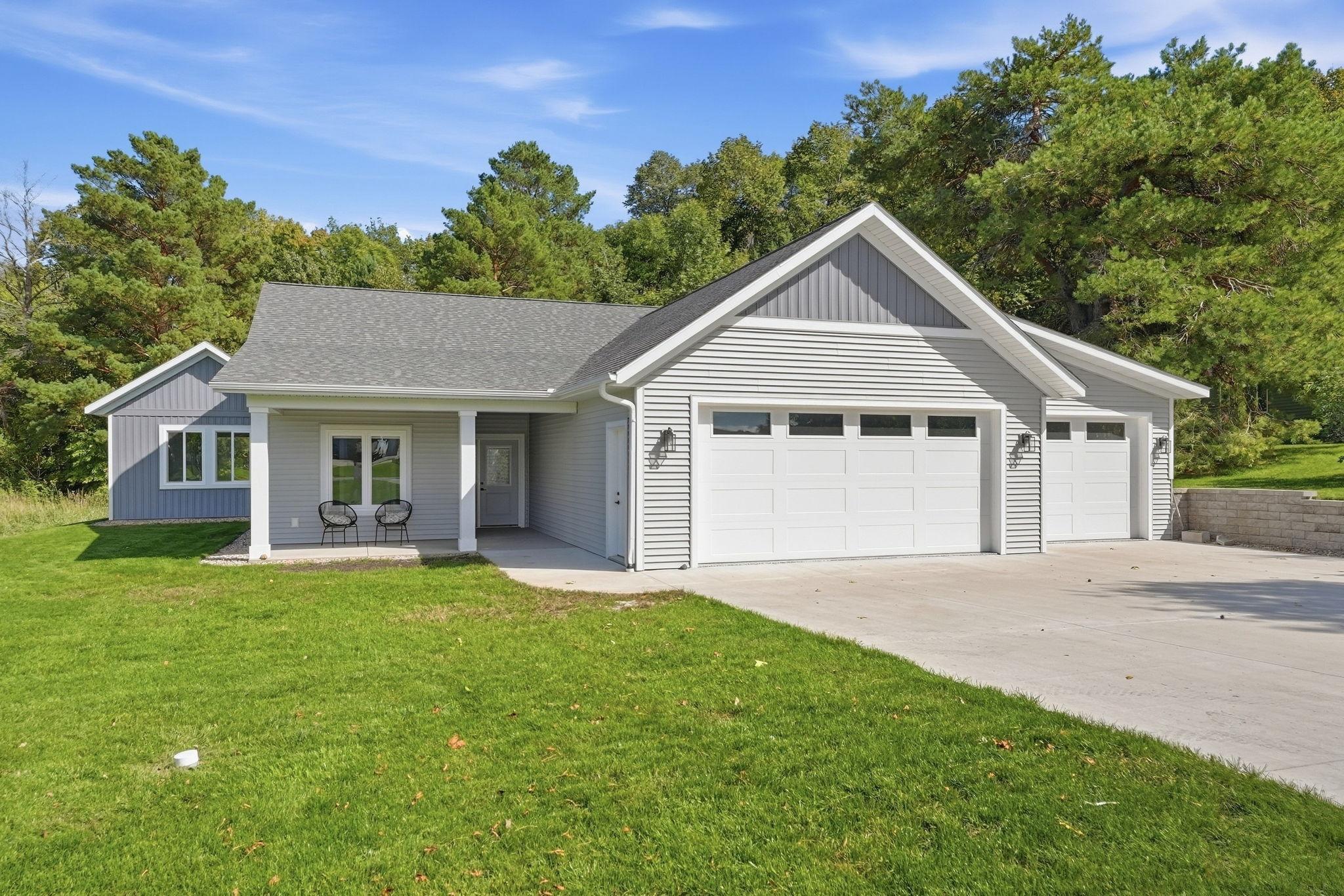 Enjoy the ease of one-level living in this high-end patio home in an established Alexandria neighborhood. An open floor plan and vaulted ceilings give the main living space an airy feel, while a gas fireplace makes the family room a welcoming place to unwind. Step onto the rear patio for a quiet morning or an easy evening outdoors. The private backyard is a blank canvas for the garden, landscaping or outdoor retreat you’ve pictured, with an irrigation system already in place. Even the garage stands out with its high-end finished floor. Leave the stairs behind and spend more time doing what you love: a paved walking and biking path is nearby, and the public beach on Lake Le Homme Dieu is a short distance away. Head out for a swim, walk or ride, then come home to the privacy and comfort of your own space. Enjoy the Alexandria Lakes Area lifestyle with room to make this home your own.