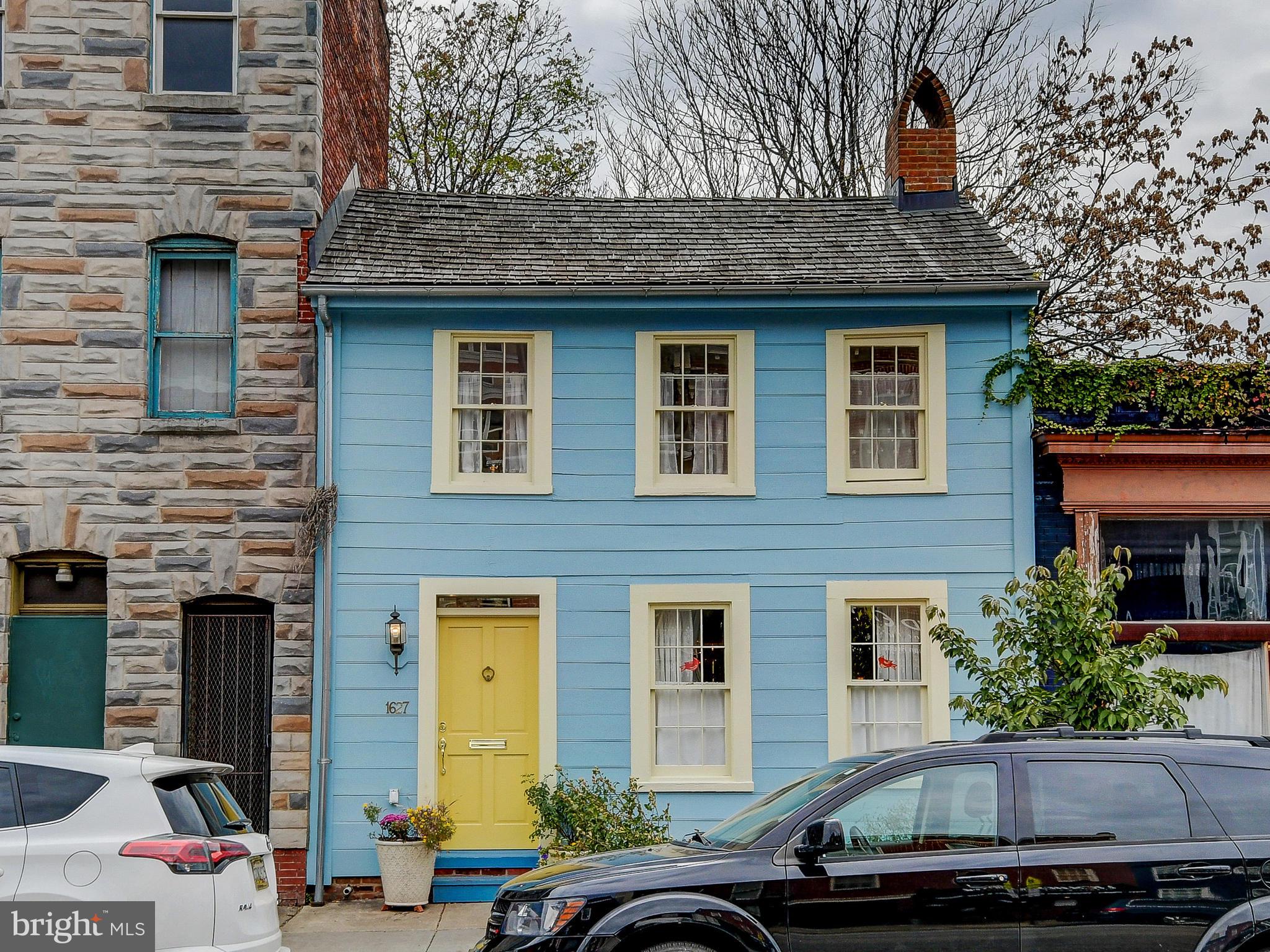 Available starting July 1, 2026. Your country cottage in the city, combining quaint charm with the best of urban living. Perhaps the oldest, and largest, surviving wooden house in Baltimore, this home was built in 1787 and completely restored in 2011 with additional improvements in 2014. This home is offered fully furnished. The cozy living room features a 19th century decorative mirrored fireplace. The open kitchen and dining room floor plan adds a modern feel to this period home. The updated kitchen has marble counters and custom cabinetry. The first floor powder room is right off the kitchen. Step through the back door onto a landscaped brick patio with plenty of room to entertain. The second floor primary bedroom overlooks the yard and includes a built-in dresser with marble top. A second floor full bath has a skylight and built-in storage under a marble counter and laundry closet. A generous walk in closet is located in the center of the home. The second bedroom is in the front of the home with two large windows overlooking Aliceanna Street, with an attached closet. This home is ideally located just steps from the Fell's Point waterfront with its many dining and entertainment options, and is within easy walking distance to Harbor East and the flagship Whole Foods market. The North Market food hall and South Market Choptank crab house are just around the corner, while the elegant Pendry Hotel is three blocks away. Once the home of Nicolas Leeke, a schoolmaster, and later of the famous privateer of the war of 1812, Captain Thomas Boyle, this house was awarded The Preserve America Steward Award, signed by Michelle Obama, in 2012.