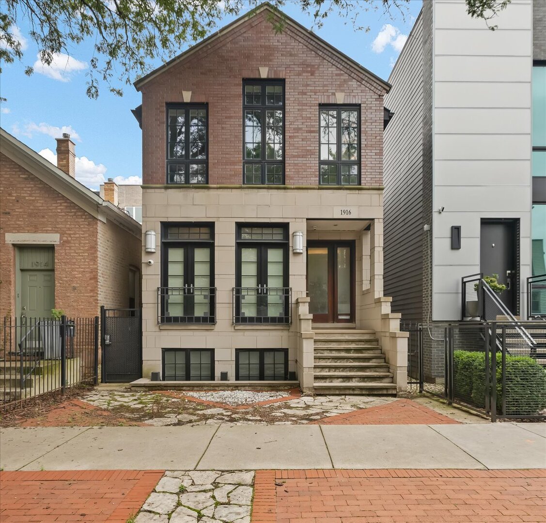 On the market for the first time, this custom Bucktown residence is tucked away on a peaceful street that is a 5 minute walk to both the Western Blue Line and the 606 / Bloomingdale Trail. The main level impresses with diagonally laid hardwood floors, intricate millwork framing the windows and doors, two fireplaces, and a dramatic staircase accented by glass panels and a two-story glass block wall that floods the space with natural light. The living room is anchored by French doors opening to a Juliet balcony, while the front and rear of the home are separated by a clever double-closet hallway and a jewel-box powder room featuring leather-studded walls. The open-concept great room combines kitchen, dining, and sitting areas - complete with espresso-colored custom cabinetry, a fireplace, striking light fixtures, and access to a small deck. The L-shaped kitchen showcases sleek black granite, a brand-new gas cooktop island, wall oven with convection, separate GE Advantium halogen oven, and an oversized pantry. From the deck, stairs lead to the garage rooftop, prepped with lighting and electricity and ready to become your future urban oasis. Enjoy the rare convenience of a hallway with direct access to the 2 car heated garage. The second floor skylights pour light into the cathedral-ceilinged hallways. A full-sized laundry closet makes wash day effortless. The primary suite stuns with an entrance hall lined with a walk-in closet on one side and a spa-like bath on the other. Floating cabinetry, dual shower heads, and soaring ceilings elevate the ensuite, while the oversized bedroom offers cathedral ceilings and French doors that open to potential for a future balcony or catwalk to the garage rooftop. Two additional bedrooms and one additional full hall bathroom all feature cathedral ceilings, generous closets, and abundant natural light. The lower level is finished with porcelain tile floors, high ceilings, large windows, and a full bathroom, the basement's front section is ideal as a family or media room. The rear section, once used as a business office, can easily transform into a massive bedroom, in-law suite, or creative live/work space with its own wet bar and private entrance.  Modern conveniences include central vacuum, built-in flush-mount speakers, a home security system with cameras, dual-zoned furnaces, heated floors in the basement and primary bath, and recessed lighting throughout. The location is unbeatable - directly across from Ehrler Park and near Holstein Park, with neighborhood favorites like Floyd's Pub, Irazu, Margie's Candies, and independent coffee shops just steps away. Commuting is effortless with nearby public transit, the Clybourn Metra, and quick access to I-90/94.