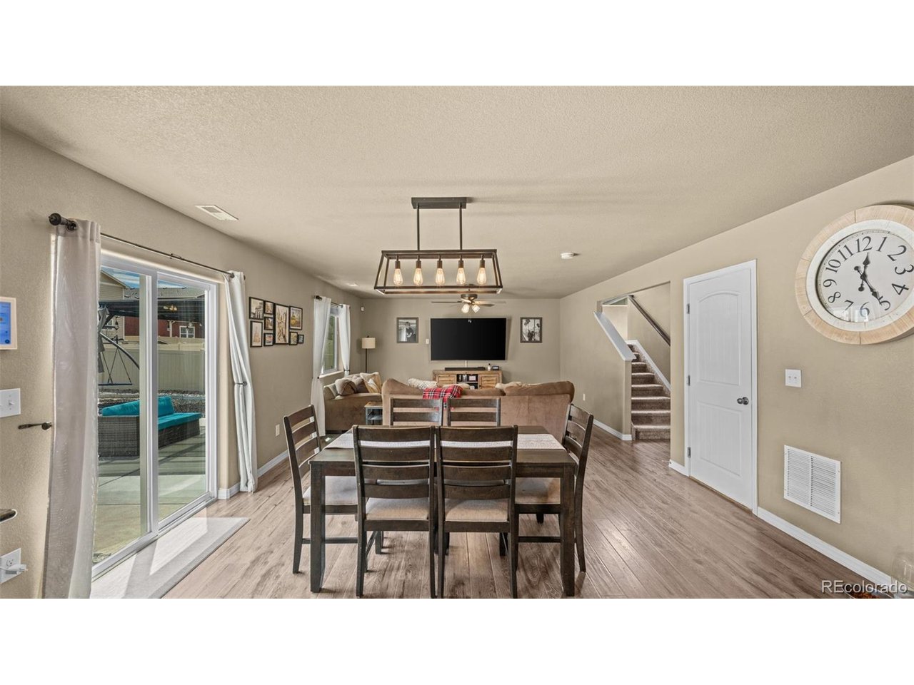 Welcome home to this beautifully maintained two-story residence offering the perfect blend of modern comfort, functional living, and inviting spaces designed for everyday life. The open-concept main level is ideal for both entertaining and daily living, featuring a private office with French doors just off the entry, perfect for working from home or creating a quiet flex space.The spacious living room flows seamlessly into the dining area and well-appointed kitchen featuring stainless steel appliances, abundant cabinetry, generous counter space, a pantry, and a large center island that serves as the heart of the home. Whether hosting family and friends or enjoying a quiet evening at home, this thoughtfully designed layout offers comfort and functionality. A convenient main-level powder bath completes the first floor.Upstairs, retreat to the expansive primary suite complete with a large walk-in closet and an en-suite bath featuring dual vanities and a spacious walk-in shower. The upper level also offers generously sized secondary bedrooms, a full bathroom, and a conveniently located laundry room, making everyday living both comfortable and efficient.Step outside to a backyard thoughtfully designed for outdoor living, featuring a low-maintenance vinyl privacy fence, oversized concrete patio, covered pergola, low-maintenance artificial turf, and a dedicated play area that offers plenty of space to relax, entertain, and enjoy Colorado's beautiful weather.A welcoming covered front porch enhances the home's curb appeal, while the convenient location provides easy access to Fort Carson, Peterson Space Force Base, Schriever Space Force Base, schools, shopping, dining, parks, walking trails, and major commuter routes. Offering a thoughtful floor plan, inviting indoor and outdoor living spaces, and an exceptional location, this home is ready for its next owners to enjoy.