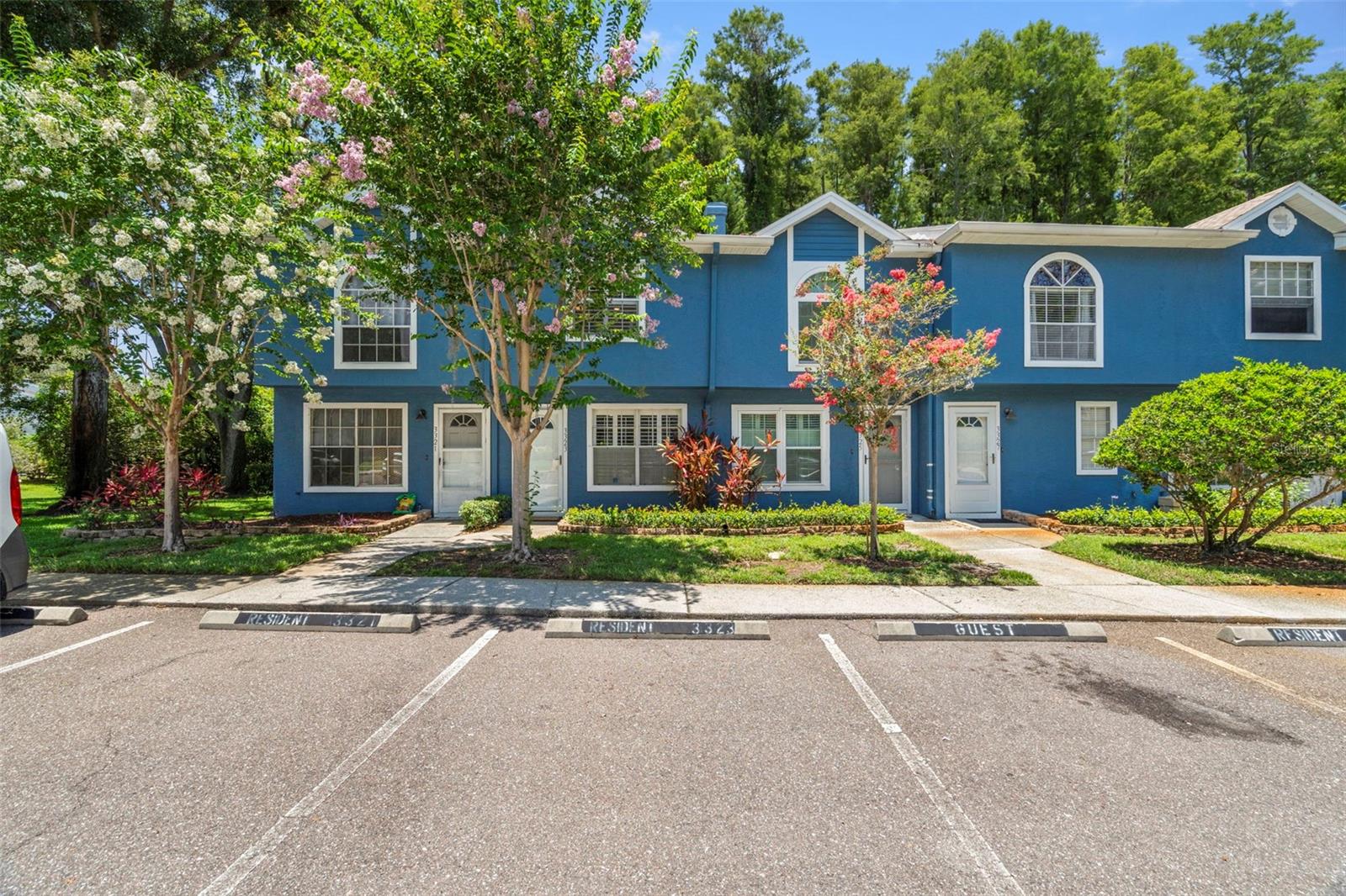 Honey, stop the car!!! This stunning townhome in the highly desirable Fox Chase community of Palm Harbor is truly one of a kind. Unlikeneighboring units, this property features a bonus room off the kitchen that can be used as an office, play space, or even additional storage! The home underwent a full makeover in 2020, showcasing brand-new flooring on the main level, plush carpeting upstairs, fresh paint throughout, and a beautifully updated kitchen with sleek countertops, modern cabinetry, and all-new appliances—including a refrigerator, microwave, dishwasher, washer, and dryer. New light fixtures throughout the home add a warm, contemporary touch, while a brand-new roof installed in 2025 provides years of low-maintenance living. The home also has a HVAC that was replaced in 2020. Inside, you'll appreciate the smart layout with a convenient first-floor powder bath, two upstairs bedrooms each with ensuite bathrooms, and vaulted ceilings that enhance the sense of space. The kitchen opens to a cozy dining area complete with a wet bar, perfect for entertaining, and sliding doors lead out to a lanai overlooking serene wooded views. The home is nestled within a well-maintained community that offers fantastic amenities, including a pool, playground, and tennis courts—and a brand-new gate has just been installed at the entrance, enhancing both security and curb appeal. Located just minutes from Gulf beaches, top-rated schools—including Sutherland Elementary, Palm Harbor Middle, and Palm Harbor University High—local shopping, restaurants, and easy access to Tampa and St. Pete, this home checks every box. Whether you’re a first-time buyer or looking for a beautiful place to call home, this move-in ready townhome is a rare find in a prime location. Don’t miss your opportunity to own one of the most updated and uniqueunits in Fox Chase!