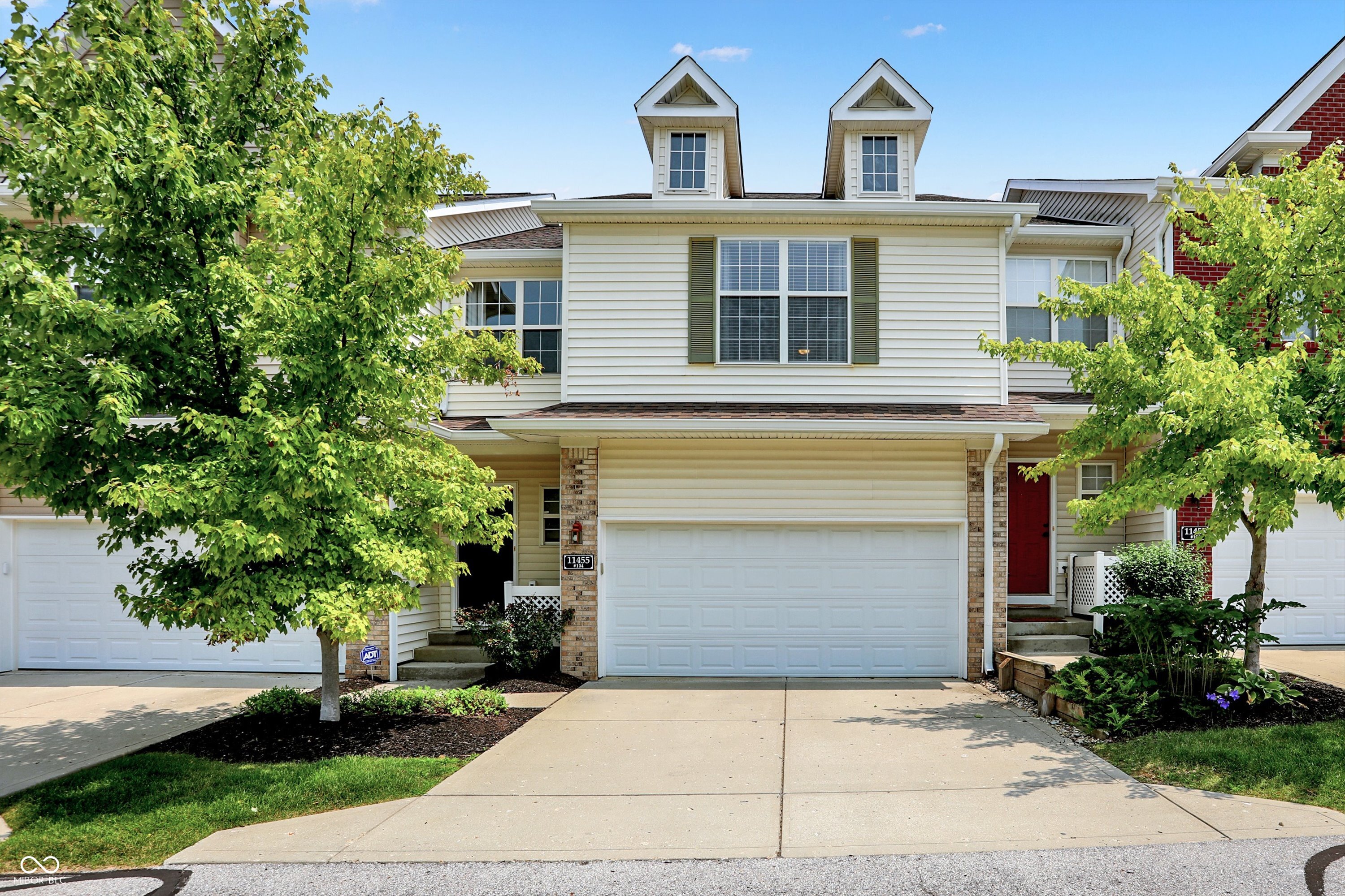 ONE OF THE BEST PRICED TOWNHOMES IN THE BEST LOCATION! Just a short walk to the Nickel Plate District w/mult dining options/brewery/cigar lounge/fitness studios/retail shopping & a bike ride to Top Golf/downtown Fishers/Ikea/Target & so much more! Kroger supermarket is a 1 minute walk & I-69/SR37 is a 2 minute drive! The owners have elevated the home since their purchase & the view is one of the best in the neighborhood, overlooking mature trees & water! The main level offers a spacious great rm w/fireplace, flex space for dining or office, a sunroom & open to a beautiful kitchen! Upper level features a lovely owners suite w/WI closet & luxurious bath + 2 more bedrooms & full bath! Finished lower level w/family rm, storage rm. Deck & patio!