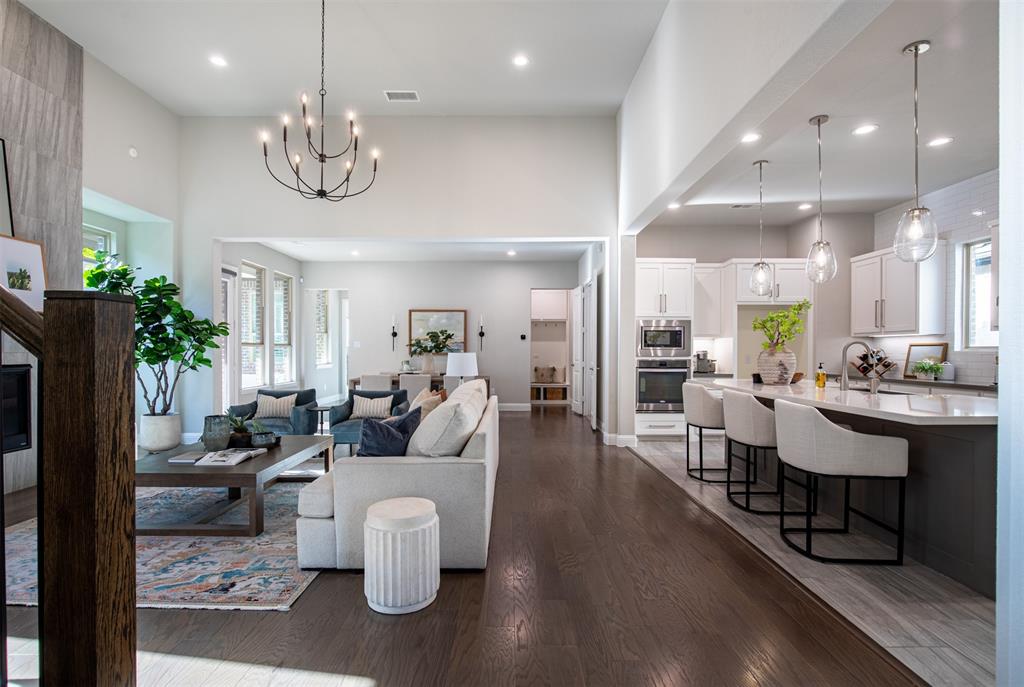 LOVE WHERE YOU LIVE! Experience a resort-style, fitness-forward lifestyle at 7205 Avondale Dr, an impeccably maintained 3,170 SF masterpiece by Ashton Woods - Newsweek’s 2025 Most Trustworthy Builder- nestled in  highly sought-after Trails at Craig Ranch and the A-rated Frisco ISD. This residence is a masterclass in modern luxury, beginning with its classic brick exterior, custom stone borders & professional landscape lighting located on premium greenbelt. Designed for high-end entertaining & ultimate convenience. The open-concept living area is flooded with natural light, highlighting sleek engineered hardwoods & a chef’s showstopper kitchen featuring quartz countertops, full-width pot & pan drawers & stunning counter-to-ceiling tile feature wall. Dedicated media room on 1st floor. The standout feature of this thoughtfully designed layout is the rare inclusion of two spacious first-floor bedrooms, each with private bathroom access, offering unparalleled privacy and ease for everyone. Enjoy a first-floor study with elegant French doors and sweeping views of the lush greenbelt; its generous size & strategic location allow it to easily convert into a fourth bedroom, home gym, or playroom. Upstairs game room with elevated views of greenbelt, alongside a spacious third en-suite bedroom, ensuring every occupant has their own retreat. Walk to Life Time Fitness luxury destination, which offers members 12 lighted outdoor pickleball courts & heated 50-meter lap pool. Walking distance to TPC Craig Ranch, proud host of the PGA TOUR’s CJ CUP Byron Nelson. Every May, the neighborhood comes alive with electric energy as the world’s top golfers compete right in your backyard! Nearby to premium 0.5-mile rubberized track, a brand-new playground & dog park. Conveniently located near District 121, HUB 121 & Legacy West. Centrally located near major corporate HQ, including Toyota North America, JP Morgan Chase, & Liberty Mutual. Easy access to DFW & Dallas Love Field airports. 3D Tour