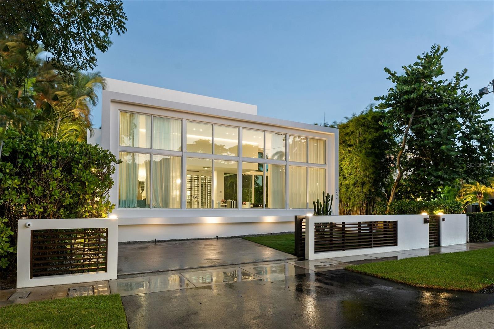 Welcome to 4433 North Bay Road, a modern masterpiece by world-renowned architect DOMO on Miami Beach’s Billionaire Row. Situated on an elevated site among Miami Beach’s legendary legacy estates, this turnkey 3,534-sq-ft residence combines security, privacy, and unparalleled prestige. Inside, soaring ceilings, Venetian plaster finishes, and a climate-controlled glass wine cellar define spaces of refined elegance. The chef’s kitchen, equipped with Sub-Zero and Viking appliances, balances functionality with bespoke design. Outdoors, a heated saltwater pool, professional-grade BBQ, private terraces, and thoughtfully curated entertaining spaces create a seamless fusion of luxury and lifestyle. Every element has been considered to provide a residence that is as rare as it is remarkable. Due to a decreasing supply of available homes, opportunities to live on Billionaire Row are quickly dwindling. This is not merely a home; it is a legacy, a statement of distinction, and a defining chapter in the story of Miami Beach’s most exclusive enclave.