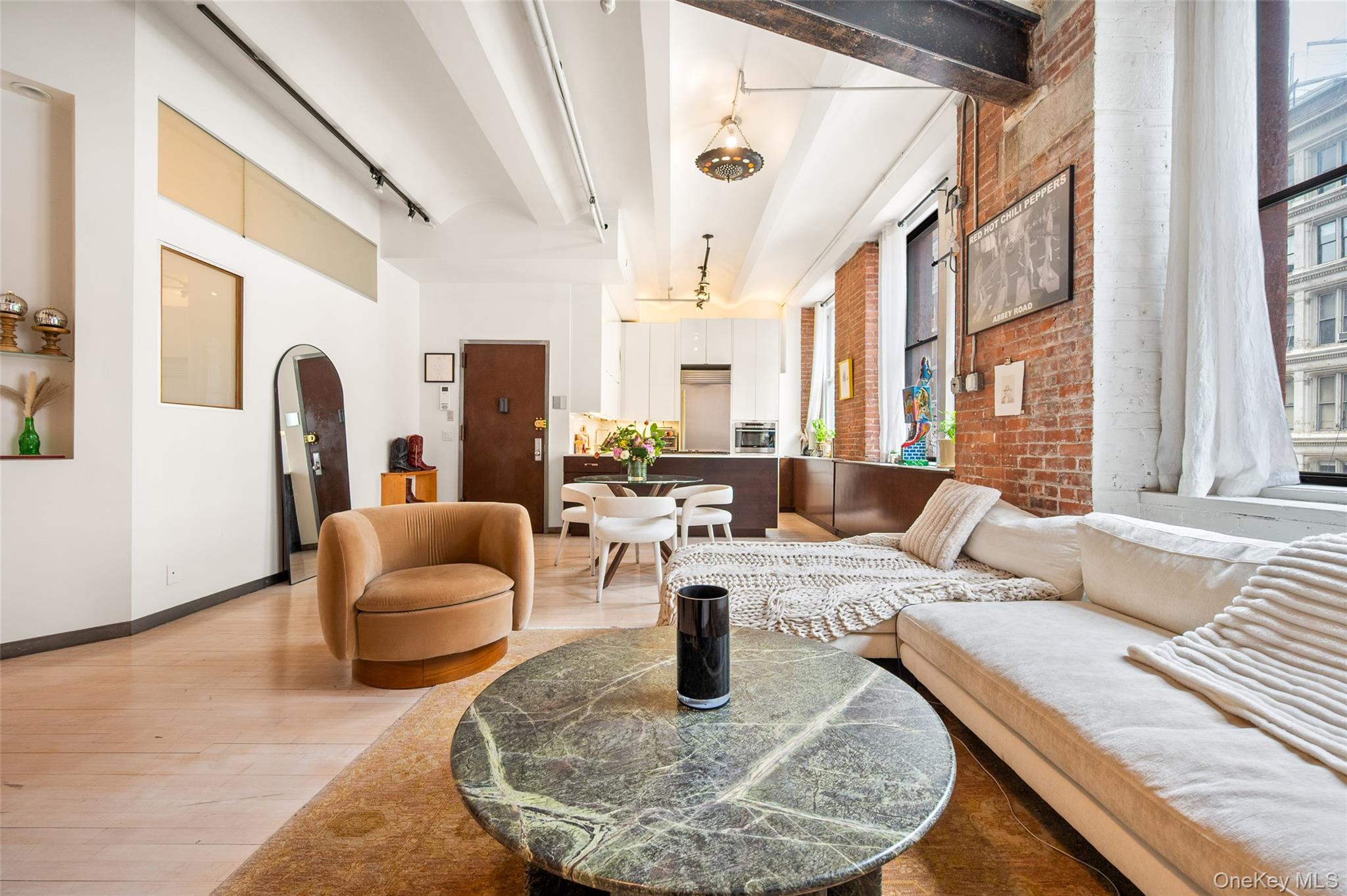 Downtown Loft Living! A rare full-floor loft in the heart of Manhattan's NoHo Historic District — more than 3,300 sq. ft. inside a landmarked cast-iron building. Currently configured as two separate apartments within a single residence, the floor can be kept as-is or combined into one sprawling, fully customized home, with the scale, character, and flexibility rarely found downtown.Apartment FeaturesWhole Floor:• Full-floor residence, 3,300+ sq. ft.• 3 bedrooms, 3 full baths, plus den & home office• Currently configured as two separate apartments — keep or combine• 11-ft barrel-vaulted ceilings• Exposed brick walls• Exposed steel columns & beams• Hardwood flooring throughout• 13 oversized windows across four exposures• Private service elevator opens directly into the residence• Potential to add central air• Low maintenance for the square footage — $3,924/mo.Western Apartment:• Primary suite: bedroom with sitting area & two large closets• Five-fixture en-suite bath in polished cement & slate• Second full bath off the den• Chef's kitchen: white lacquer cabinetry, Bosch cooktop & dishwasher, Fhiaba refrigerator & Wolf steam oven• Dining area flowing into a generous living room• Den framed by built-in shelving• Home office / flexible interior room• In-unit washer/dryerEastern Apartment:• Grand family room — nearly 1,000 sq. ft. of open loft volume• Separate second kitchen• Breakfast nook• Bedroom with large walk-in closet• Full bath• In-unit washer/dryerThe Potential (see Alternate Floor Plan):The two apartments can be combined into a single, integrated home. As envisioned in the alternate plan:• Sprawling central loft & kitchen, approx. 46 ft long• Primary suite with dedicated dressing room & spa bath• Three additional bedrooms, each with closet or dressing space• Separate den• Dedicated laundry roomBuilding:• Intimate seven-unit cooperative• Built 1889–1890 by architects D. & J. Jardine• Landmarked cast-iron building in the NoHo Historic District• Passenger & service elevators• Video intercom• Private basement storage• Live/work permitted• Financially sound, well-maintained buildingLocation & Transportation:• Set at the nexus of NoHo, Greenwich Village, the East Village, SoHo & Union Square• The Public Theater is a neighbor• Near Lafayette Grand Café & Bakery, Astor Wines & Spirits & Temple Bar• The Wegmans at Astor Place close at hand• Multiple express & local subway lines• Easy access across Manhattan and Brooklyn