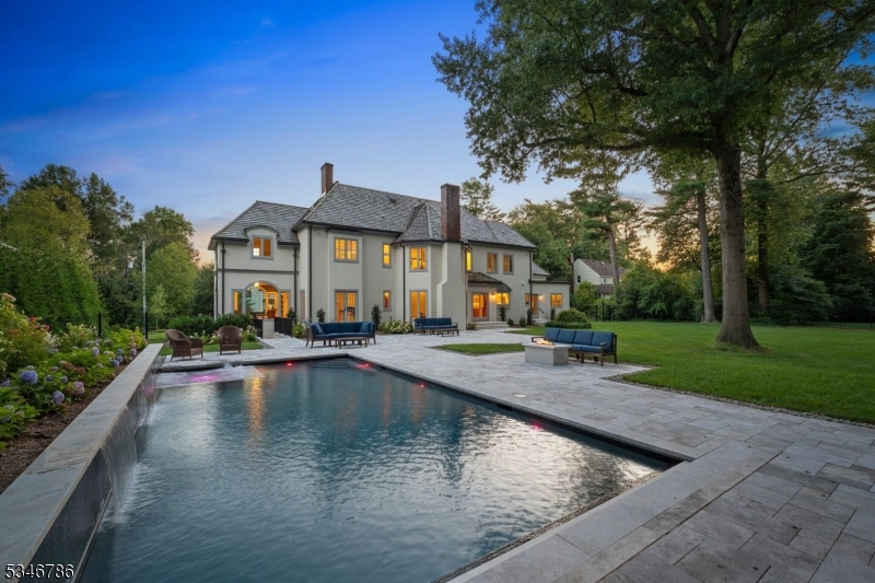 Incredible custom home, built on one level acre, situated on private road with a cul-de-sac.Exceptional blend of timeless elegance and modern comfort. It's beautiful design features 7 bedrooms, 8 bathrooms, and a sun-filled, open layout perfect for both entertaining and everyday living. At the heart of the home, the chef's kitchen includes premium appliances, custom cabinetry, and a spacious island that invites conversation over morning coffee or evening cocktails. The adjoining family room, with its cozy fireplace and wall of windows, overlooks the lush backyard, heated pool and gas firepit, offering a tranquil retreat for relaxation or outdoor entertaining.The primary suite is a sanctuary, boasting a spa-like ensuite, a generous walk-in closet, and peaceful views that make every morning feel like a getaway.Beyond the home itself, 15 Linden Lane offers the lifestyle you've been searching for. Situated in one of Chatham's most sought-after neighborhoods, you're minutes from top-rated schools, vibrant downtown shops and dining, and effortless access to NYC. Whether it's an evening stroll through tree-lined streets or a weekend spent exploring nearby parks, this home is a perfect backdrop for a life well-lived.