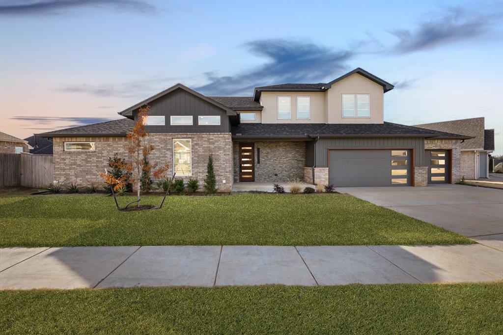 This new modern residence, in Rockwell Park, offers an unparalleled blend of luxury, comfort, and thoughtful design at 7316 NW 158th St. Upon entering, you’ll be captivated by the bright and airy open-concept living area, where expansive windows and clean lines create a welcoming flow between the gourmet kitchen, dining space, and living room. A beautifully designed built-in unit enhances both functionality and style in the main living space. The chef’s kitchen is a true centerpiece, featuring abundant counter space, a central island, and sleek finishes ideal for both culinary creations and casual gatherings. The downstairs primary suite serves as a private sanctuary, offering a serene atmosphere designed for relaxation and rejuvenation. Barn doors open to a spa-like en-suite bathroom featuring a free-standing tub surrounded by full-wall tile and a luxurious shower. Upstairs, you’ll find three additional bedrooms and a well-appointed bathroom, along with easy attic access. All secondary bedrooms are thoughtfully arranged on the same floor, creating an ideal layout. The three-car garage provides abundant room for vehicles, and storage, and offers direct access to a mudroom designed for effortless organization of shoes, coats, and outdoor gear. For those in need of a dedicated workspace, a conveniently located pocket office provides privacy and versatility—perfect for working from home. The laundry room connects directly to the primary suite and includes a sink and workspace. Highlights: Tankless water tank, Blinds, Zoned Sprinkler System. Located within Deer Creek School District. Its prime location offers quick access to the John Kilpatrick Turnpike, placing premier shopping, dining, & entertainment just minutes away. With modern finishes, carefully selected details, and a layout tailored for today’s lifestyle, this exceptional home is ready to impress even the most discerning buyer. $10,000 towards closing costs when partnering with Builder's preferred lender.