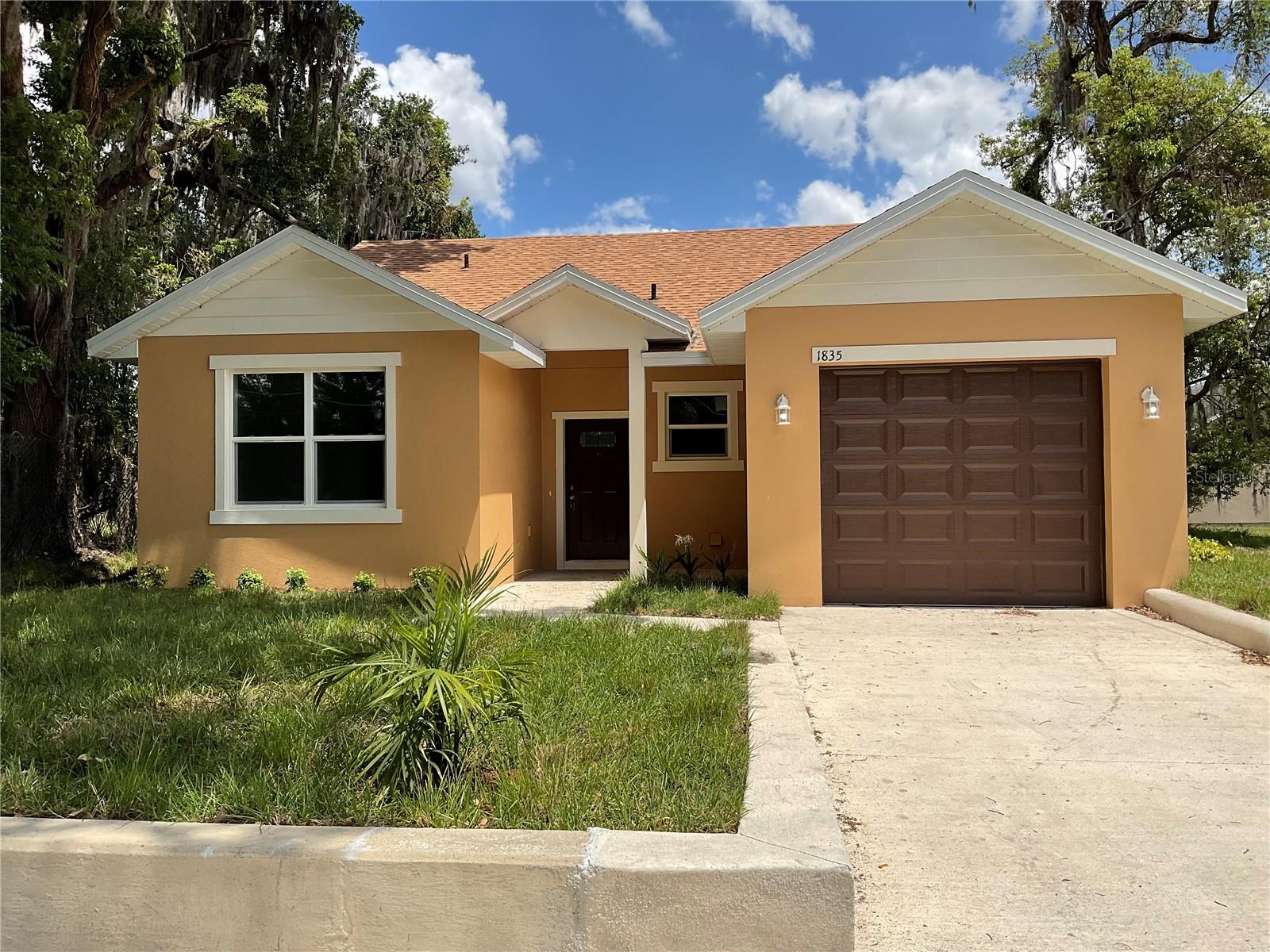 This stunning BRAND NEW "AFFORDABLE" CONSTRUCTION features 3 bedrooms, 2 bathrooms, and an 8 foot high one car garage (not the typical 7 foot high garage, but high enough to park a truck. NO HOA!! The gourmet kitchen is a chef's delight, featuring upgraded granite countertops, soft close cabinets, touchless faucet, and brand-new stainless steel appliances ready to inspire your culinary creations. Throughout the home, you'll enjoy beautiful, low-maintenance flooring—no carpet in sight, no dirty grout lines! Split bedroom layout.  This home places you close to I-4, downtown, schools, shopping, dining, restaurants, and local amenities and adventure. Don’t miss your chance to own this beautiful property. Did I mention there is NO HOA? Schedule your viewing today! You will love it!