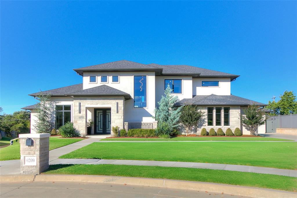 Nestled within the gated Turnberry section of Oak Tree Country Club, this 2020 Custom Home blends modern architecture with timeless sophistication. Every detail reflects thoughtful design, quality craftsmanship, and quiet luxury.

The open-concept layout showcases soaring ceilings, walls of glass, and seamless indoor–outdoor flow — ideal for both entertaining and everyday living. The chef’s kitchen is equipped with premium appliances, custom cabinetry, and a large hidden butler’s pantry complete with ice maker and wine fridge. A media room and private gym extend the home’s livable space, while Stealth Acoustics invisible speakers and refined lighting create an atmosphere of understated elegance throughout.

The primary suite is a true retreat, featuring spa-inspired finishes, TWO oversized walk-in closets, the home gym / flex space, direct access to the main level laundry room and peaceful views of the backyard — already prepped for a future pool. A solid concrete second floor provides exceptional sound insulation, and thoughtful additions like two laundry rooms, a three-car garage, and an in-ground storm shelter bring practicality to the beauty.

Situated on a quiet cul-de-sac within an Edmond premier golf community, residents enjoy access to Oak Tree’s championship golf, dining, fitness, and social amenities. This property offers a rare blend of contemporary design and country-club lifestyle — all just minutes from top Edmond schools, restaurants, and city conveniences.  Curious about amenities and membership options, be sure to check out Oak Tree's public site outlining all their membership options.