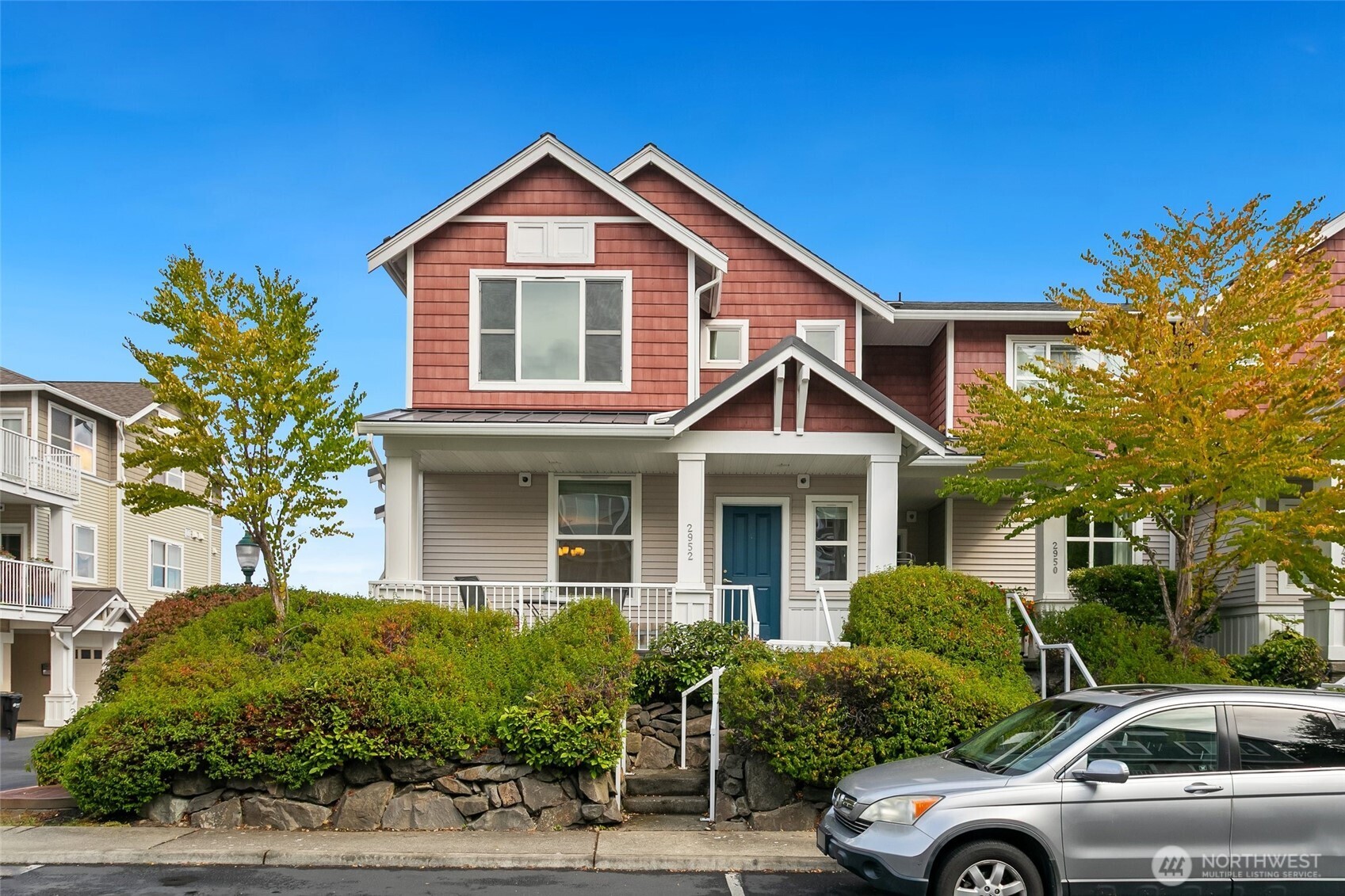 Experience effortless West Seattle living in this light-filled, turn-key townhome perched on a prime corner lot in High Point! Fresh paint and hardwoods accentuate the main floor, where tall ceilings create a bright, spacious feel that lives exceptionally well. The open main level features a cozy fireplace, dining area, kitchen w/ stainless appliances, and ½ bath. Upstairs you’ll find the primary suite with both a walk-in closet and an en suite bath with double sinks. A 2nd, well-sized bedroom and full bath complete the floor. The lower level has laundry and access to an attached oversized 1-car garage, with additional reserved parking available. Outstanding use of square footage near parks, dining, coffee, and transit!