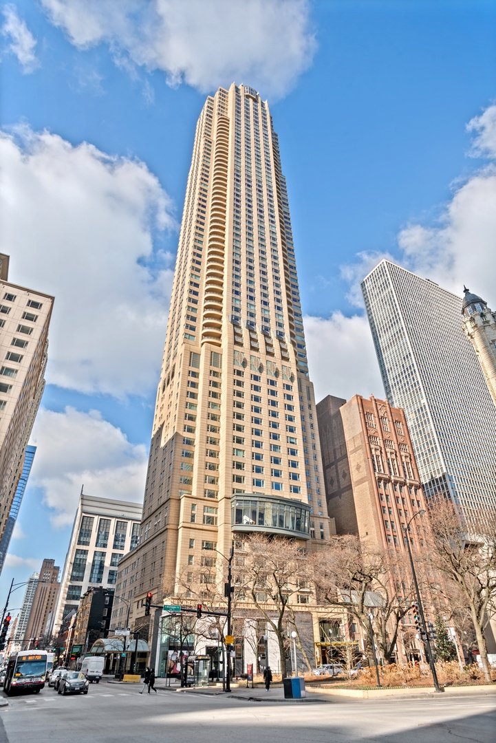 Motivated Seller offers unparalleled opportunity to own a full floor penthouse at a truly outstanding value! Spanning 8,400 square feet, this residence offers 360-degree views of Chicago's iconic skyline, world-class architecture, and Lake Michigan, delivering front-row sunrise to sunset views.  Perched above the Park Hyatt Hotel, this 5-bedroom, 4.2-bath home provides access to top-tier amenities: Spa, Indoor Pool, Fitness Center, In-Room Dining, and NoMI Restaurant.  Enter the home through your own private and secure elevator foyer, leading to an expansive living and dining area with windows perfectly framing the lake, and illuminated by gallery-grade ERCO lighting to highlight any art collection. The thoughtful layout balances space both for large scale entertaining or quiet evenings at home.   Crafted with the finest finishes and materials throughout, including an exceptional Bulthaup kitchen with integrated professional appliances.   2 garage parking spaces included. Premier location offering everything a first-class city like Chicago has to offer, within walking distance: Acclaimed Dining, Shopping, Museums, Lakefront, River Walk, Harbors, and more. Welcome Home.