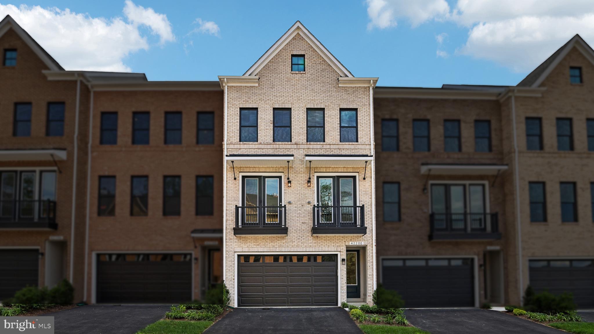 Live in a brand NEW TOWNHOME at West Park III by Van Metre Homes in Brambleton, VA with a two-car, front-load garage with an electric vehicle car charging circuit, four bedrooms, three full bathrooms, and two half bathrooms. Homesite 4533 (Turner 22-F2-RT Plan) is ready for you to call home IMMEDIATELY and has never been lived in. In this home, the open-concept layout connects the kitchen, great, and dining room, enhanced by 9 ft. ceilings on all levels and Luxury Vinyl Plank (LVP) flooring in the main areas, primary bedroom, multi-gen suite, and loft. The kitchen is complete with soft-close cabinets, stainless steel appliances, and quartz countertops. But that is not all! Enjoy a deck off the cafe, dual balconies off the great room, and an upper-level roof terrace for seamless outdoor living. Upstairs, the primary suite features a spa-inspired 4-piece bathroom, complete with dual vanities, a linen closet, a framed shower enclosure with floor-to-ceiling tile, and a built-in seat. This level also includes two additional bedrooms, a full bathroom with dual sinks, and a conveniently located laundry room. On the upper or fourth level, you will find a spacious loft offering an added flex space, a half bathroom, and your rooftop terrace. The lower level features a two-car garage and a walkout bedroom with a full bathroom and a generous walk-in closet, perfect for guests or additional living space. Additionally, the home is solar-ready for any future projects. Being a new build, your home is constructed to the highest energy efficiency standards, comes with a post-settlement warranty, and has never been lived in before! Take advantage of closing cost assistance by choosing Intercoastal Mortgage and Walker Title. Self-schedule a tour today by visiting our website or get in contact with a Van Metre Sales Advisor for more details.-----Welcome to West Park III, a vibrant neighborhood of dreamy townhomes with rooftop terrace options in the award-winning community of Brambleton, VA. Experience an exceptional living experience in Brambleton, a flourishing community where modern living meets suburban charm. This family-friendly community offers miles of trails, tot lots, parks, pools, highly sought-after schools within walking distance, and so much more at your fingertips. With the bustling Brambleton Town Center just down the street, you can enjoy endless shopping, dining, and entertainment options. Rise to new heights at West Park III and experience the perfect blend of comfort, convenience, and connectivity—a place where cloud nine is just the beginning. -----*Other homes sites and delivery dates may be available. Pricing, offers, and availability are subject to change without notice. Images, renderings, and site plans are for illustrative purposes only and may not reflect actual homes or features. Some renderings may depict a similar home. Additional terms and conditions may apply. West Park III lies within the Airport Impact Overlay District (entirely within 1 Mile Buffer). Due to its proximity to Dulles International Airport, this site is subject to aircraft overflights and aircraft noise. Please see a Van Metre Sales Advisor for details.