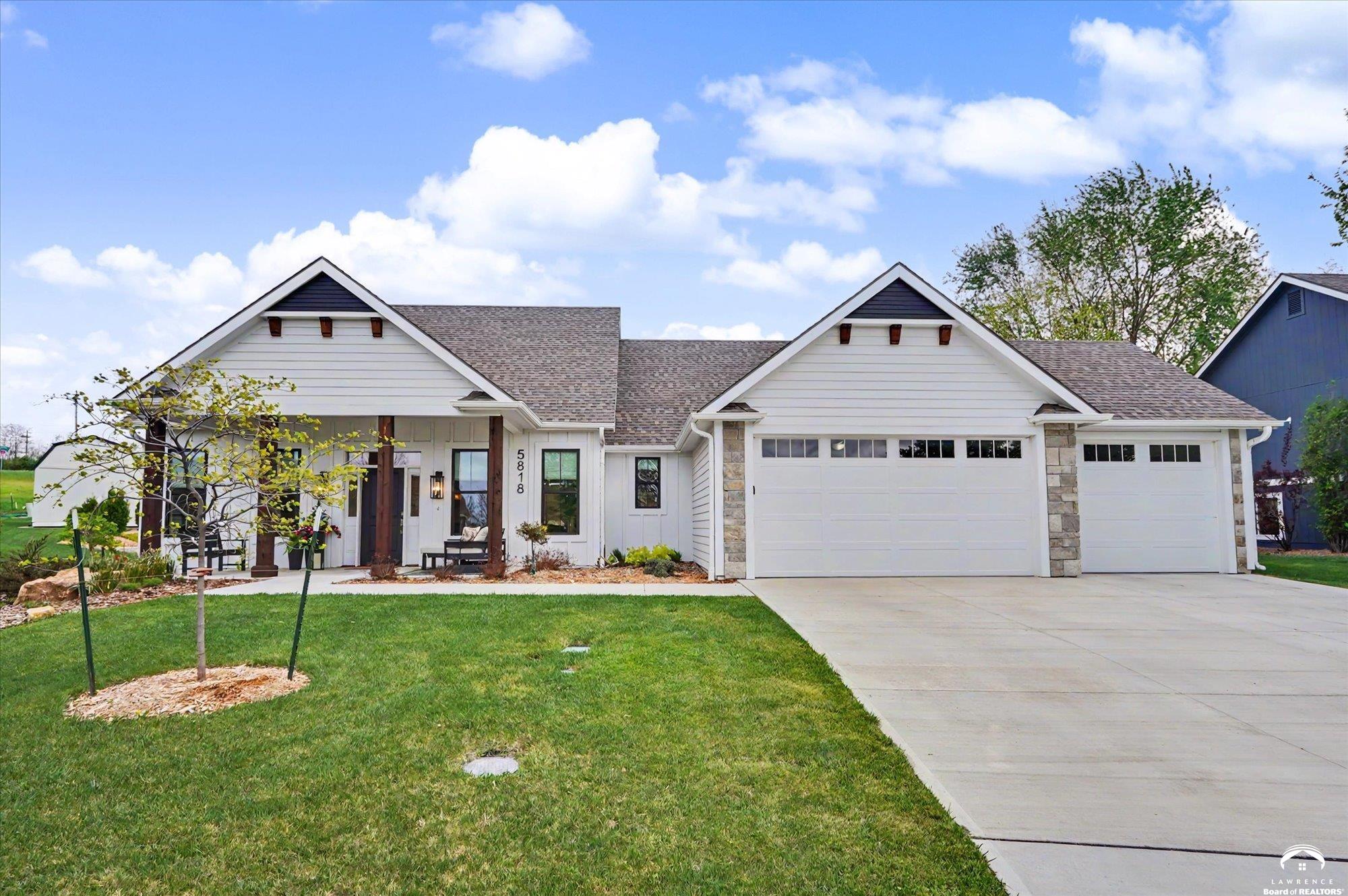 Why You’ll Love This HomeBuilt in Spring 2024  this home showcases exceptional craftsmanship, thoughtful upgrades, and superior attention to detail throughout. Now, with two years of established landscaping, you benefit from a mature setting that new construction simply can’t offer. The expanded in-ground sprinkler system supports lush greenery designed for both privacy and a welcoming habitat for birds and butterflies.Prime NW Lawrence LocationPerfectly positioned at the end of a quiet cul-de-sac, this home combines privacy with convenience. Enjoy quick access to Hwy 10 and I-70, making commuting effortless. Nearby amenities include outdoor recreation at Jayhawk Park and Lawrence Recreation Pavilion, education at Langston Hughes Elementary School, and top-tier healthcare at LMH Health West Campus. The area continues to grow rapidly, highlighted by the addition of Costco nearby.True Single-Level LivingDesigned for ease and accessibility, this home features no stairs—everything you need is on one level, including the front entrance, spacious 3-car garage, and covered backyard patio.Energy Efficiency & Peace of MindBuilt with modern standards and certified for energy efficiency, this home offers comfort, sustainability, and the confidence of lower utility costs year-round.Thoughtful, Functional LayoutThe open-concept design centers around a stunning kitchen with a large walk-in pantry and brand-new appliances—perfect for both daily living and entertaining.    •    The private primary suite is situated on the east side of the home and features a spacious bedroom, a luxurious five-piece bathroom, and a large walk-in closet with custom built-ins.    •    The closet also doubles as a secure storm shelter with reinforced one-foot-thick concrete walls and connects directly to the laundry room for added convenience.    •    On the west side, two additional bedrooms and a beautifully appointed bathroom provide comfort and privacy
