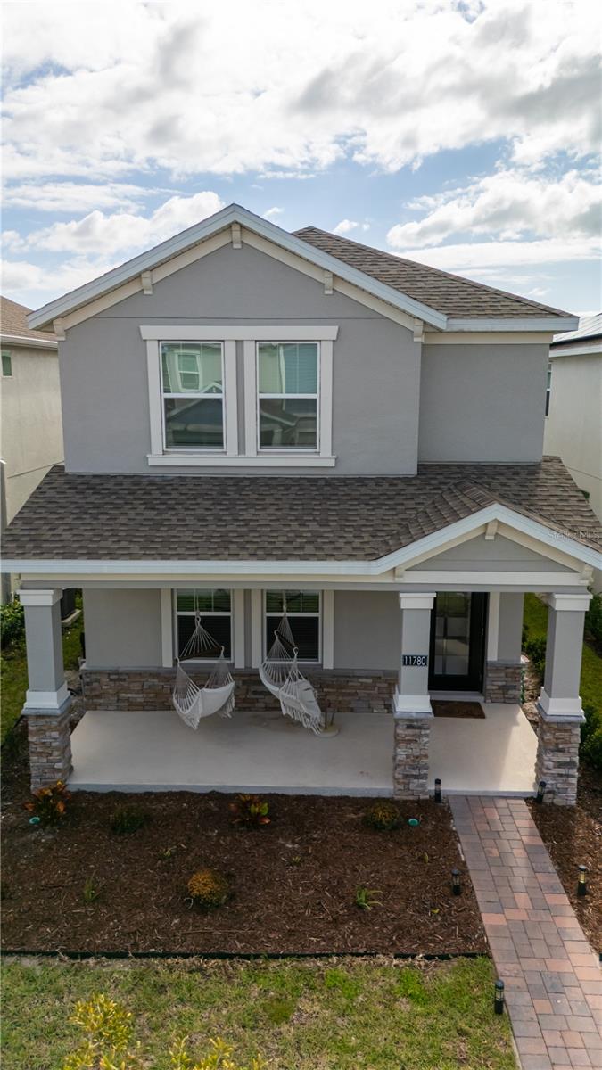 2024 Construction. This magnificent three bedroom, two and a half bathroom home features a two car garage located on the back of the property and open patio. Spread over two stories, this floor plan offers all the space your family will need. There is a family room, a kitchen that overlooks the dining room, and a study. Additional space includes a covered front porch and a large owner suite.  This property has the following updates: new light fixtures on great room, dinning room, kitchen light pendants, new ceiling fans on all bedrooms, new washer/dryer, new water softener/filter, new garage epoxy 3D floor and a bonus GYM system on the garage (weights are not included).  Storey Park is unlike any other in the Orlando area! We have a resort style pool, lap pool, splash pad, a Jacuzzi spa, a state-of-the-art fitness center, a food pavilion, tennis court, a big playing field for football or soccer games, walking trails, dog park.  So, stop by and see why you will want to be part of the fastest growing area in all of Orlando!
