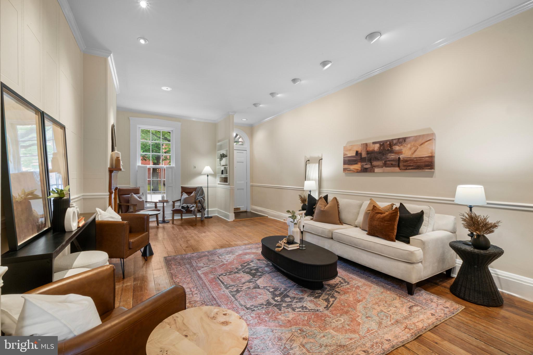 Architecturally distinctive three-level row home located on one of Historic Federal Hill’s premier tree-lined blocks. Located moments from Baltimore’s most sought-after attractions. This beautifully maintained 4-bedroom, 2.5-bath residence seamlessly blends timeless historic character with thoughtful modern updates. The sun-filled main level features soaring 12-foot ceilings, original hardwood floors, custom built-ins, and expansive living and dining spaces . A conveniently located powder room leads to the gourmet chef’s kitchen, complete with a custom built refrigerator, gas range, abundant cabinetry, built-in media center, and breakfast area. The kitchen opens directly to a private courtyard, creating the perfect indoor-outdoor living experience. The upper levels offer four spacious bedrooms, including a luxurious primary bedroom with a sitting area, generous closet space, and an updated bath featuring modern finishes. The fourth bedroom is currently configured as a home office with extensive built-ins and dedicated workspace, ideal for today’s remote professional. Additional highlights include updated bathrooms throughout, dual-zoned HVAC, a partially finished basement providing flexible living space, and a separate storage room. Ideally situated just two blocks from the Inner Harbor and within walking distance of Federal Hill Park, Cross Street Market, downtown Baltimore, and both Ravens and Orioles stadiums, this exceptional home offers the perfect combination of historic charm, modern comfort, and an unbeatable location in one of Baltimore’s most iconic neighborhoods.Be sure to also watch the video!