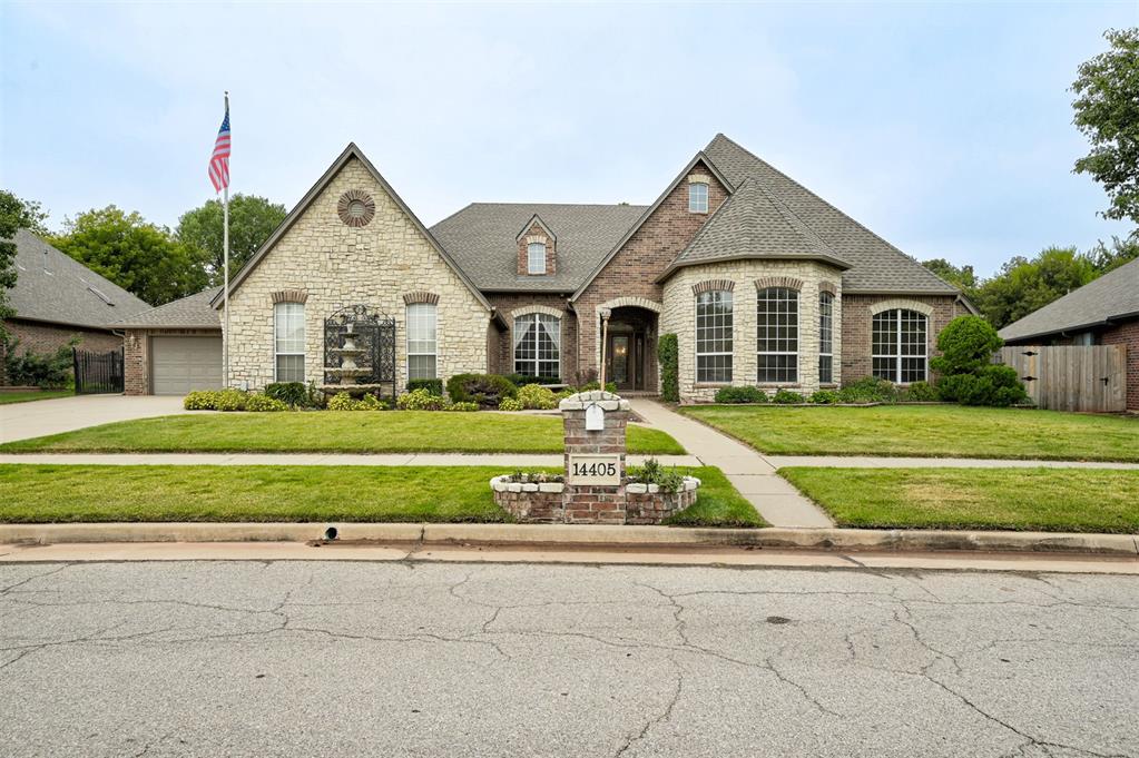 In-town living in park-like private setting on .3 acres in front with a back area.6 acres that has wooded area beyond. This is a one-of-a-kind custom built, one owner, well-maintained home.

This one story lovely home, has spacious outdoor living and kitchen area with rock stream alongside custom designed pool. This home is loaded with custom qualities too numerous to list...i.e. Zoysia grass, eletric attic lift, master quality customized oak cabinetry throughout, oversized garages and attic space.,

stamped concrete non-slip around the pool, pergola, beautiful floor-plan with one section of home featuring handicap accessibility with its own kitchen/living/bathroom/bedroom, and a four-car garage. Absolutely ideal location and neighborhood - within a mile you have easy accessibility to highways (Hefner Parkway and also the Kilpatrick Turnpike). Also nearby is a large variety of shopping, restaurants, hotels, Mercy Hospital, Frances Tuttle V-Tech, etc. This is unique and special property.