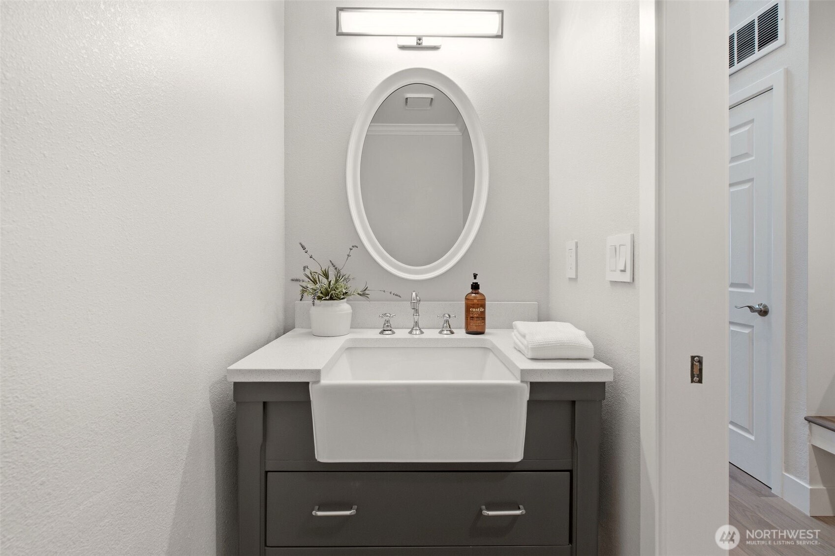 Stylish powder room with a sleek vanity and modern finishes.
