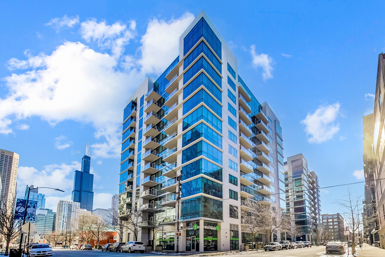 RARELY AVAILABLE! Stunning, Sun-Filled 2BD/2BA Corner Unit at the very desirable Emerald Building in the Heart of the West Loop! Floor-to-Ceiling Windows with North and West Views of the Sunset and Tons of Natural Light! Open Floor Plan with Updated White Kitchen feat. Large Island w/ Seating, Quartz Counters, Storage and Prep Space, 42" Cabinets, Pantry & SS Appliances flowing into Spacious Living Room w/ an Outdoor balcony boasting incredible views of the City! Complete Serenity. Private Primary Suite w/ Custom built Walk-in-Closet & Full Bathroom w/ Double Sink Vanity & Walk-in Shower. Front Loading Washer/Dryer. There is no Condo like this in the building! Freshly Painted. Storage Unit and Full Amenity Building which includes: 24 Hour Doorman, Mailroom, Fully-Equiped Fitness Room, Residents Lounge, Party Room and Business Center.  1 additonal Parking Space available for 30,000. Pet Friendly & Investor Friendly Bldg w/ no Rental Cap. Extremely convenient location in one of Chicago's best neighborhoods! Steps from Mariano's, Whole Foods, Dog Park, Public Transportation, Expressway, and all the top shelf restaurants in the West Loop.  Welcome Home to the Emerald Building!