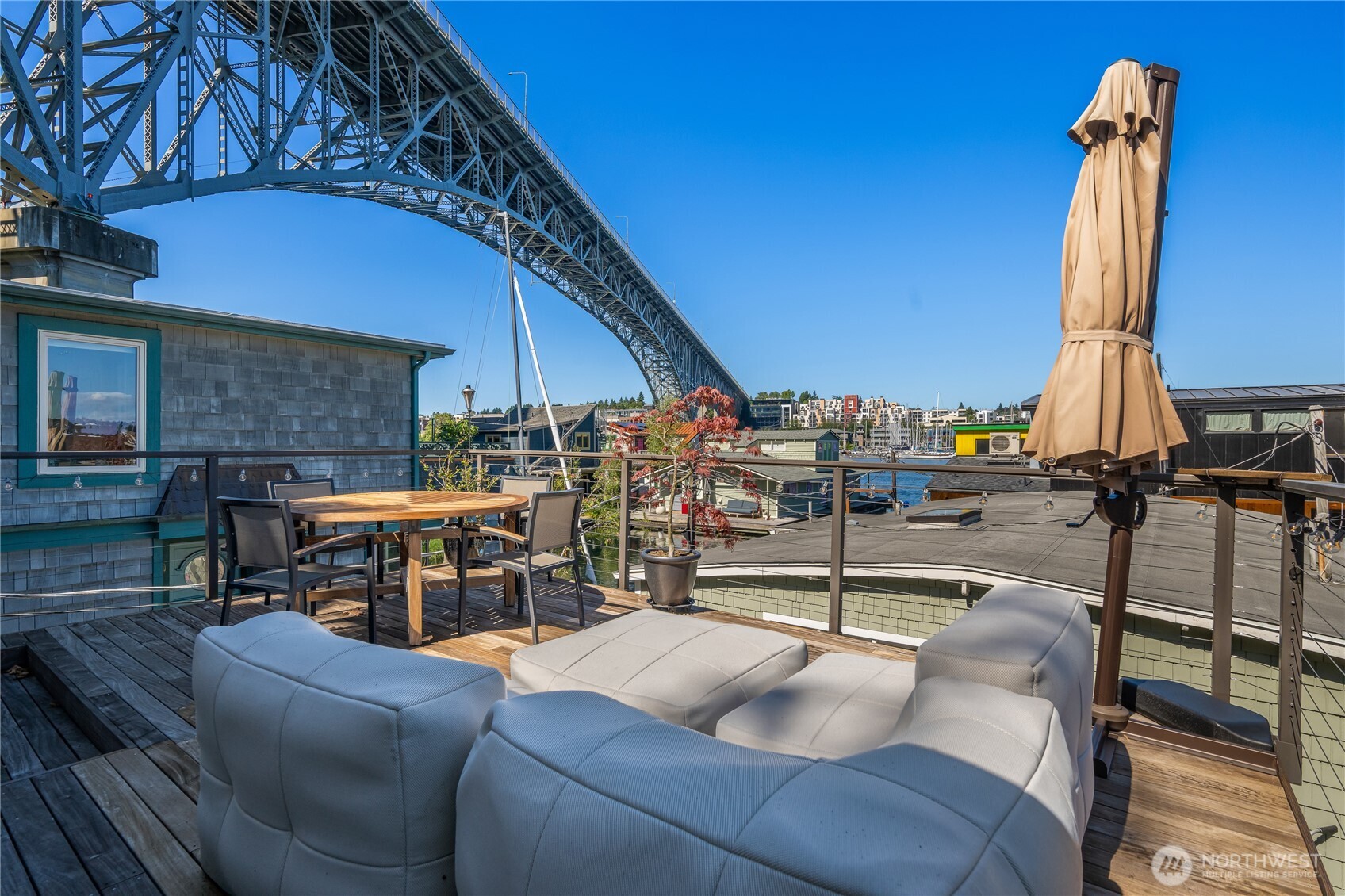 Enjoy life living on the water. You’ll love this beautiful craftsman floating home that has been fully updated. Relax on the rooftop deck and soak in the expansive views, a perfect place to entertain. Or enjoy the wrap-around deck, that hovers just above the water. The upper-level flex room with vaulted ceilings is perfect as a family room, home office, or convert it into another bedroom. The open kitchen and great room create a sophisticated space for entertaining guests. Tons of counter space and storage. One bedroom with a full bath and laundry are also on the main floor. Enjoy water living on this dock of only 5 homes.