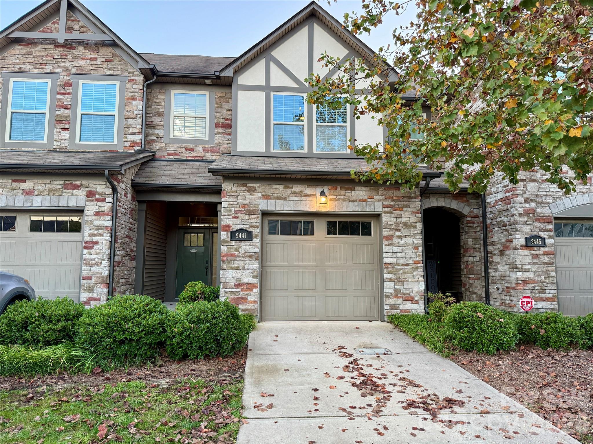 Enjoy peaceful nature views and resort-style living in Charlotte’s premier Berewick community! Backing directly to a lush wooded backdrop, quiet pond, and walking trails, this one-owner townhome captures serene green views through a floor-to-ceiling wall of glass. The main level boasts rich dark engineered hardwoods, a cozy fireplace, designer paint palette, and a built-in drop zone bench right off the entry. The open kitchen features an expansive island, granite countertops, stainless steel appliances with a gas range, tile backsplash, and elegant pendant lighting. Step outside to your private outdoor retreat—complete with an extended paver patio, privacy fence, and a retractable awning perfect for shade. Upstairs features 3 spacious bedrooms, including a primary suite with a deep soaking tub and separate shower, plus a 1-car garage with extra storage. Enjoy top Berewick amenities: Manor House, fitness center, pools, pickleball, basketball, and scenic trails!
