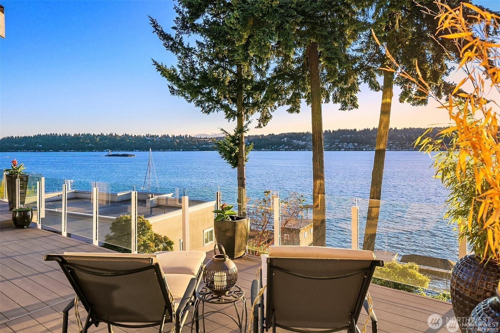 Experience spectacular sunsets and the ultimate in lakefront living on glimmering Lake WA. With over $100K in recent updates, this effortlessly sophisticated home is ready for you to fully enjoy life on the lake. Abundant daylight beams throughout. Lounge on the deck and marvel at the show on the water. Unwind on the terrace or stroll to your private dock. Sip a cold drink under the shady lakeside pergola (w 3/4 bath). Or relax in the home where travertine floors flow through the open-concept floor plan. A full bar and a wine cellar. Seaplanes, Christmas boats, bald eagles, otters at play and deer. There’s even a secret room waiting to be discovered. Near Inglewood CC. A rare opportunity to own 68' of premium lake frontage.