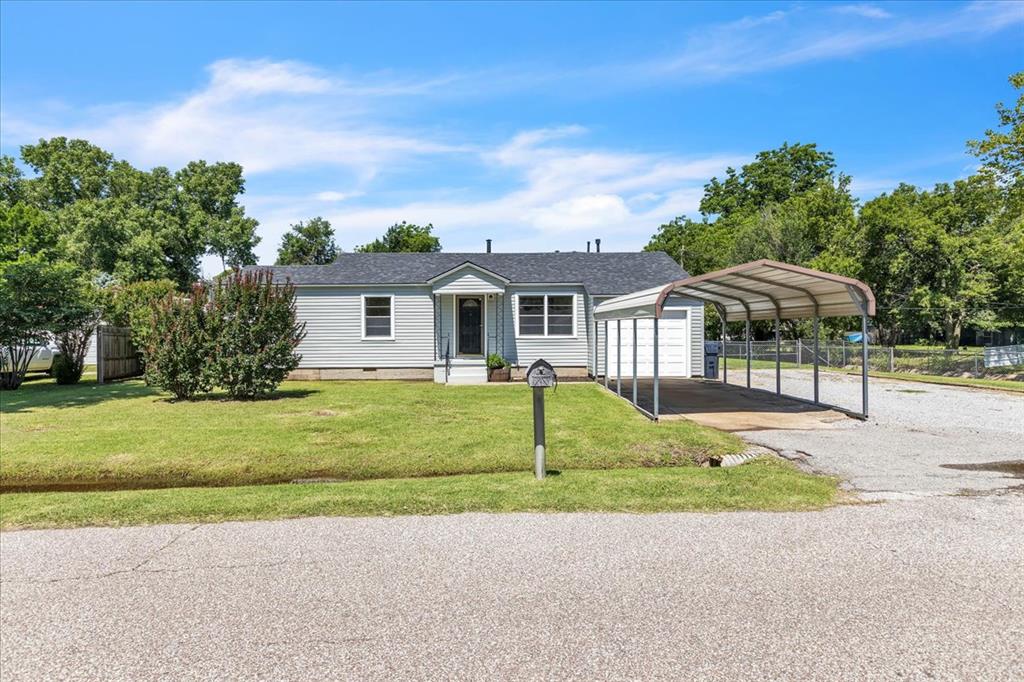 Welcome to this beautifully remodeled home, in a very convenient, well established and quiet neighborhood. Greeted by a new roof (with warranty) and siding, leading you inside to the beautiful and functional interior. Once inside, you will find a spacious home with 3 beds, 2 baths and a large bonus living area! Entire home has restored hardwood and luxury vinyl plank flooring throughout. The kitchen has been redesigned from the studs, featuring designer white cabinets with soft-close hinges and slides, SS appliances, modern hardware and updated lighting making meal times a delight! The brand new master bath, also redesigned from the studs, and the newer 2nd bath, make daily routines seamless. The large laundry space/drop zone has room to spare! Dual zone heat and air systems ensure year round comfort. The large backyard features a covered patio and additional concrete space, ideal for entertaining, playtime or relaxation. There is even a chicken coop! Dedicated covered RV parking with electricity is a bonus for the travel enthusiasts, or business owners with large equipment to protect. A fully functional garage, extra covered parking and driveway space add to the functionality of this home. Additional updates include a new main water line and electric service panel, entire home interior texture and paint in designer colors, new woodwork, hardware, modern lighting fixtures, etc...too many to list! Schedule your visit today, Welcome Home!
