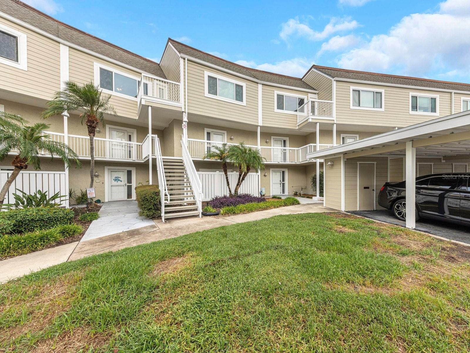 From the moment you walk through the front door, your eyes are drawn directly to the ocean, with breathtaking water views from nearly every room in this beautifully remodeled coastal home. The 40-foot patio sits just 20 feet from the seawall, offering the perfect place to relax, entertain, watch boats go by, and enjoy incredible views of dolphins, manatees, and stingrays just beyond your backyard. The kitchen is designed to take full advantage of the waterfront setting, allowing you to prepare meals while watching the boats cruise by. The home features two large bedrooms, each with its own full bathroom and two designer closets, plus a separate room with a brand-new Murphy bed that can easily be converted into a comfortable third bedroom. Everything has been completely remodeled and updated within the past year, including all-new kitchen appliances, kitchen cabinets, vanities, flooring, and hot water heater, and the home has not been occupied since the renovations were completed. Located on the ground level with no steps to climb, this home also offers a unique office space with abundant storage, a kitchen with plenty of cabinets and a pantry, a laundry room with additional storage, and a conveniently located half bath for guests. A covered assigned parking space and storage unit at the end of the parking space provide additional convenience. The community offers resort-style amenities including a pool, picnic area, grill, shuffleboard, and a clubhouse with a kitchen, large TV, pool table, and bathrooms with showers. The HOA fee includes everything except electricity and internet. Ideally located less than a mile from the Dunedin Causeway, 2.5 miles from Honeymoon Island, 3.3 miles from downtown Dunedin, and just three blocks from the Pinellas Bike Trail, you'll also find numerous shops and restaurants close by. This is truly a rare opportunity to enjoy a fully remodeled home with spectacular ocean views, abundant storage, incredible amenities, and an unbeatable waterfront lifestyle—all while being just steps from some of Florida's most beautiful coastal wildlife and scenery.