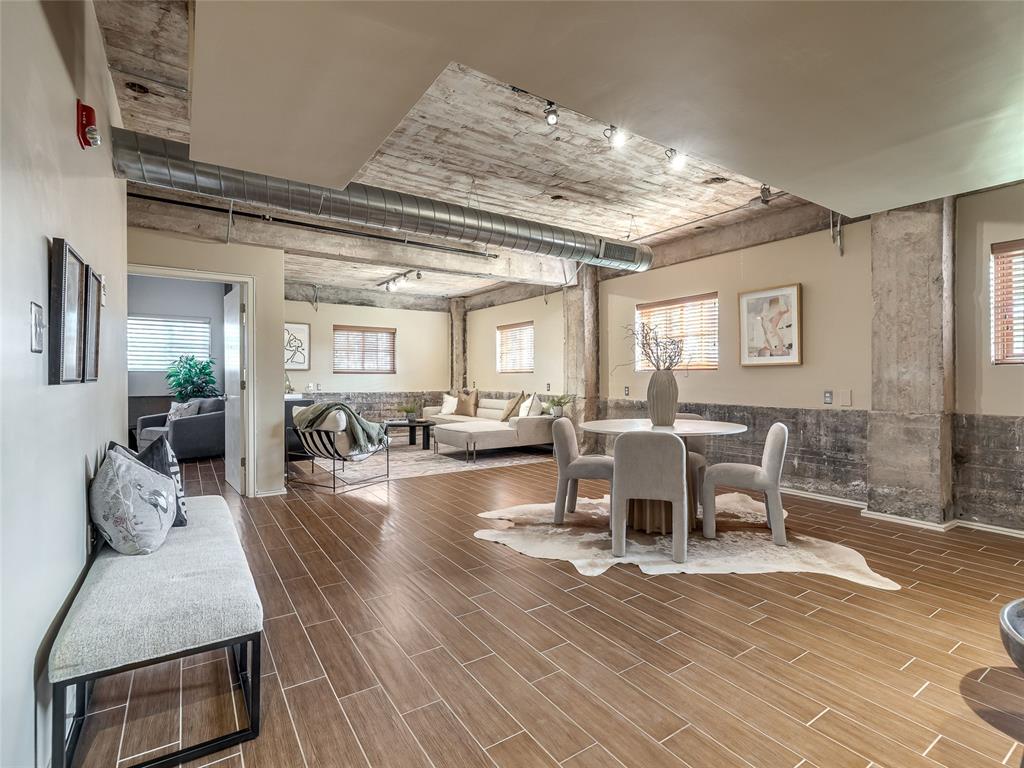 At the intersection of contemporary style and urban convenience, Harvey Lofts offers a front-row seat to the best of Oklahoma City living. This thoughtfully designed two bedroom, two bath residence pairs an open concept layout with clean modern finishes and a sleek kitchen appointed with modern appliances, generous counter space, and streamlined cabinetry creating an inviting setting for both everyday living and entertaining. Each bedroom features a private en-suite bath with heated floors, offering a comfortable retreat and exceptional flexibility for guests, roommates, or a dedicated home office. Beyond the residence, enjoy secure building access, low-maintenance living, and a rooftop deck with impressive views of the downtown skyline. The location places the best of the city just outside your door, with more than a dozen local restaurants within a two-block walk and the OKC Streetcar conveniently stopping just beyond the gate for easy access to Midtown, Bricktown, downtown destinations, and entertainment. A public pickleball court just one block away adds another amenity to this connected, active lifestyle. With contemporary interiors and an enviable walkable location, Harvey Lofts presents an opportunity to experience downtown Oklahoma City with style and ease. Schedule your showing today!