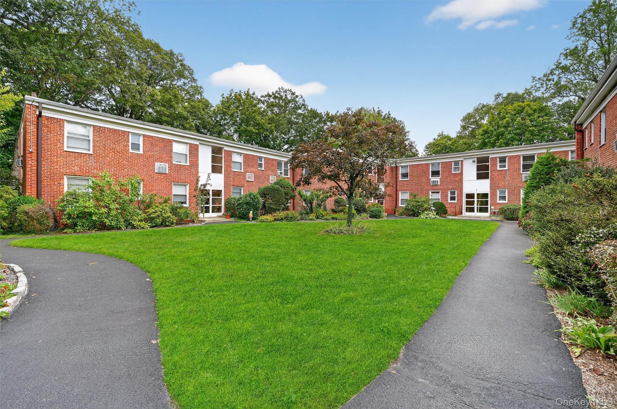 Welcome to Wildwood Gardens, one of Hartsdale’s most desirable garden-style cooperative communities offering the perfect mix of privacy, modern style, and commuter convenience. This bright top-floor corner one-bedroom has been freshly updated with refinished hardwood floors, crown molding, recessed lighting, and oversized windows that fill the home with natural light and offer peaceful tree-lined views. The modern kitchen features granite countertops, solid wood cabinetry, and stainless steel appliances, while the windowed full bath showcases custom tilework and aged bronze fixtures. The spacious bedroom includes two double-door closets with Elfa custom closet systems for optimal storage and organization. Residents enjoy assigned off-street parking, beautifully landscaped grounds with picnic and BBQ areas, on-site laundry and private storage, and a live-in superintendent. The complex also features a new outdoor security camera system for added peace of mind. Ideally located just 15 minutes from the Metro-North station and only 30 minutes into Manhattan, Wildwood Gardens offers the best of suburban serenity and city accessibility. With new updates, freshly painted throughout, stylish finishes, and unbeatable value, this move-in ready home is an exceptional opportunity in one of Hartsdale’s most sought-after co-op communities.

Residents enjoy immediate assigned off-street parking which is a highlight for the area and garages are available by waitlist. The manicured grounds with mature gardens, BBQ area and picnic tables provide a sense of calm. With one of the shortest walks to the train—and a Metro North ride just over 30 minutes into Manhattan—you’ll find the perfect balance of suburban tranquility and city access. Additional amenities include adjacent laundry facilities just outside the entrance in a secure lower level where you can also find unit specific, dedicated storage. On-premise superintendent and new outdoor camera system for safety and security.  Don't miss a rare opportunity to own a move-in-ready unit in this sought-after complex.
