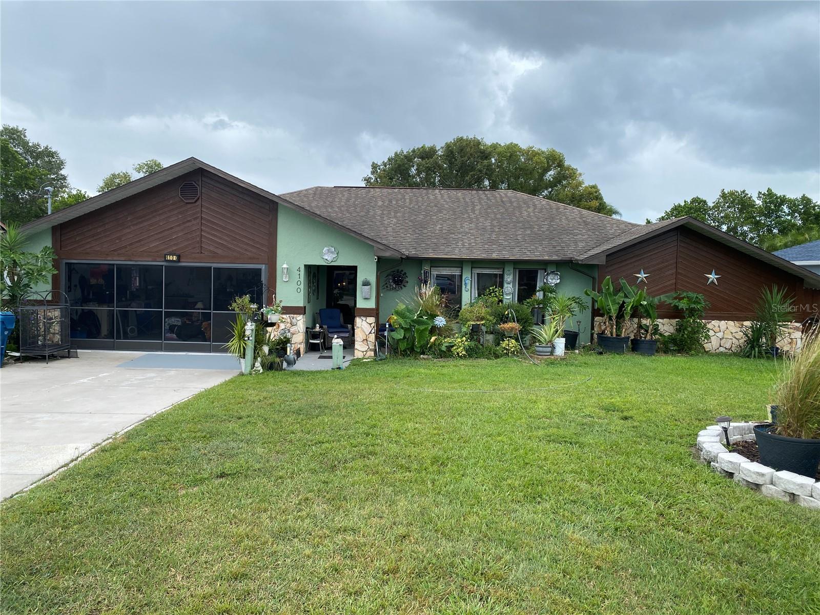 Oasis in Spring Hill! 3/2/2 Pool home with extra enclosed lanai for additional living and entertaining space. Huge pool enclosure with waterfall pool and lots of room to enjoy the outdoor area. Pool is heated. Inside is good size with updated kitchen with Corian countertops and soft close cupboards. Newer stainless steel appliances. Wet bar and sunken living room. This house is made for entertaining and enjoying life! Privacy fenced rear yard with shed. Call Today! Furniture is negotiable.