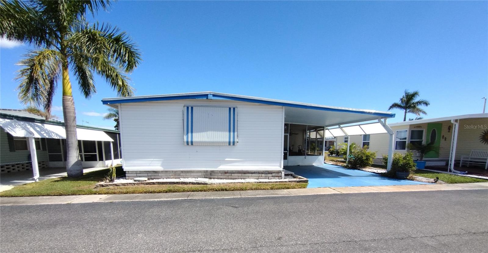This 948 sq ft home, which includes the original square footage and the enclosed front Bonus room that has heated/cooled, home boasts 2 bedrooms,1 full bathroom and is waiting for your personal touches. The large eat-in kitchen has plenty of cabinet space and a pantry. The living room is spacious and boasts and plenty of sunlight. Down the hallway you will find the guest bedroom that has a door going into the screened Florida room and shed/laundry room. The spacious bathroom has walk-in shower surround. The master bedroom has a wall of closet space. The laundry area has an access door to the shed off the enclosed screened Florida Room. No walking outside to do your laundry here. There is another access door to the back patio from the laundry room.
Golden Gate is a 55+ resident owned community where every resident owns a share of the community with private maintained roads and offers many amenities to its residents. There are men’s and women’s clubs, shuffleboard, horseshoe pit, bocce ball court, heated pool and spa, social activities, planned outings, movie nights, and so much more. The community is located close to a Walmart Super Store, or you could take your golf cart. The store has designated golf cart parking! For the golf enthusiast there is the Mainlands Gulf Club just a signal light away. It is a public 18-hole Florida links style course. There are numerous stores and restaurants within a minute&#39;s drive away and is close to major airports and interstates. Best of all it is 15 minutes from the award-winning Florida Gulf Beaches. The listing price of $85,900 includes the cost of the landshare which is valued at $45,000. Pet friendly with 1 pet allowed up to 20 pounds. Buyer to verify all measurements and restrictions and rules of the community. Requires community approval of application.
