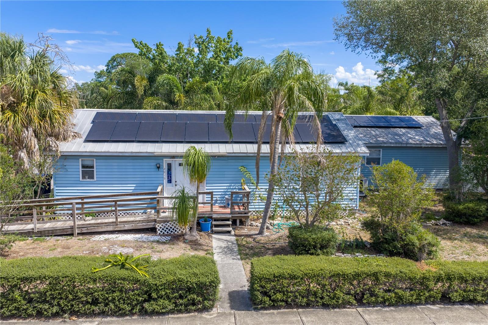 Ballast Point home available for re-zoning & re-development - this corner lot measuring 105' x 115' - a total of 12,075 SF is prime for rezoning into TWO - RS-50 or RS-60 lots for new construction. The current home is in need of updating and repairs - perfect for the right investor and includes a 2 bedroom, 2 bath home with open living, dining and kitchen with pass thru, office, indoor laundry and attached in-law suite with large living area, private bedroom & full bath plus space for kitchen hook up or bonus bedroom. Accessible ramp & interior walkways. Outside  is a large fenced yard and oversized 24' x 28' detached block construction garage with side entry. Located in the desirable Ballast Point neighborhood – with A-RATED ROBINSON IB HIGH SCHOOL and just minutes from MacDill AFB, Bayshore Blvd, and beautiful Ballast Point Park where you will enjoy a splash pad, playground, picnic areas, boat ramp, fishing pier and more! Survey & elevation certificate available.