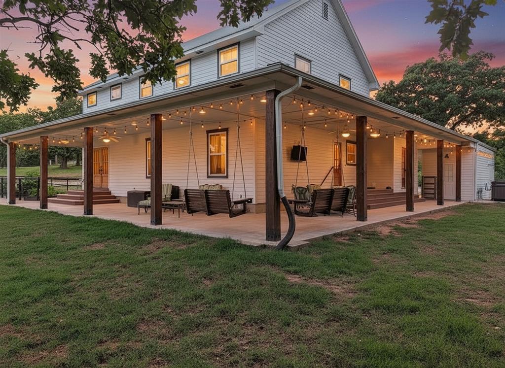 Rare opportunity to own a stunning modern farmhouse on 12 fully fenced acres bordering Lake Thunderbird and Little River State Park. With miles of public land beyond the back fence, this exceptional property offers unmatched privacy just minutes from Norman.This custom home features timeless curb appeal with crisp white siding, an energy-efficient standing seam metal roof, and a deep wraparound porch with swings, ceiling fans, and ambient lighting. A private patio with a Jacuzzi hot tub provides the perfect place to unwind and enjoy peaceful Oklahoma evenings.Inside, vaulted ceilings, designer finishes, and warm wood accents create a bright, inviting atmosphere. The spacious living room is highlighted by a striking shiplap accent wall, the kitchen features custom cherry cabinetry, leathered granite countertops, a farmhouse sink, Bosch 800 Series appliances, gas cooking, and a large walk-in pantry. A second living area offers flexibility for a home office, media room, or additional gathering space.The primary suite includes vaulted ceilings, custom details, a spa-like ensuite with dual vanities, a tiled walk-in shower, and direct patio access. Three additional bedrooms provide ample space for family and guests.Horse enthusiasts will appreciate the insulated 40x40 barn with oversized stalls, wash bay, tack room, and cooling fans. A washed sand arena, cross-fenced pastures, loafing shed, and no-climb fencing create a turnkey setup for horses and livestock.Additional amenities include raised garden beds, a small orchard, chicken coop, fenced yard, workshop, RV hookup, automatic gated entry, storm shelter, and multiple storage buildings.Prefer a different use? The barn can easily serve as a workshop, and the arena could be transformed into a custom sports court.Whether you're seeking an equestrian property, hobby farm, private retreat, or simply room to enjoy the outdoors, this one of a kind estate offers the perfect blend of country living and convenience.