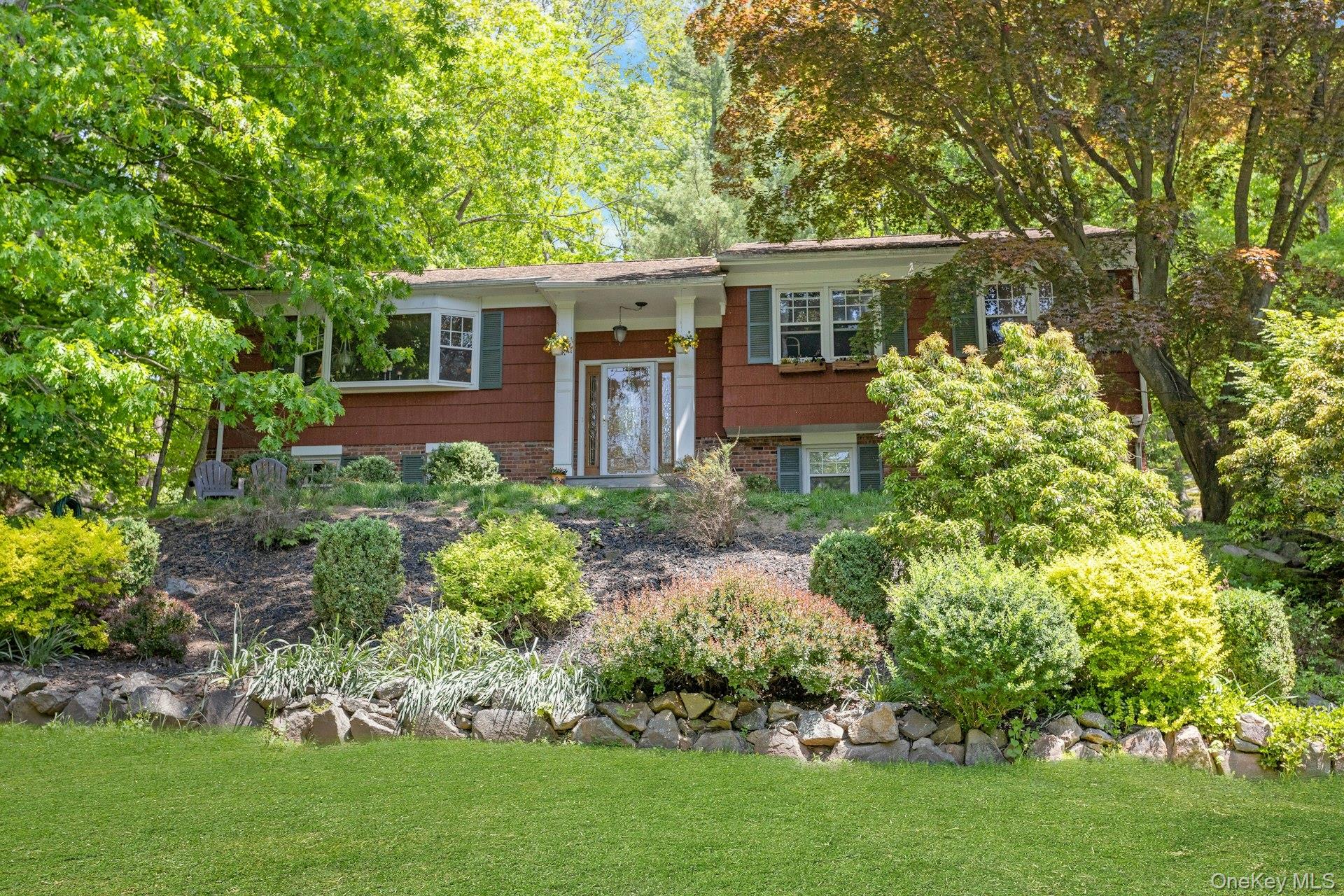 Set up on a hill in the Byram Hills Central School District, this warm and inviting three-bedroom raised ranch immediately feels like home. The front living room windows overlook a peaceful pond, while the kitchen windows and deck enjoy views of the private, rustic backyard. The walkout lower level leads to a fire pit area, with a few steps up to a level lawn complete with a swing set. Privately set back on a quiet cul-de-sac street, this home offers a wonderful sense of comfort, charm, and privacy.